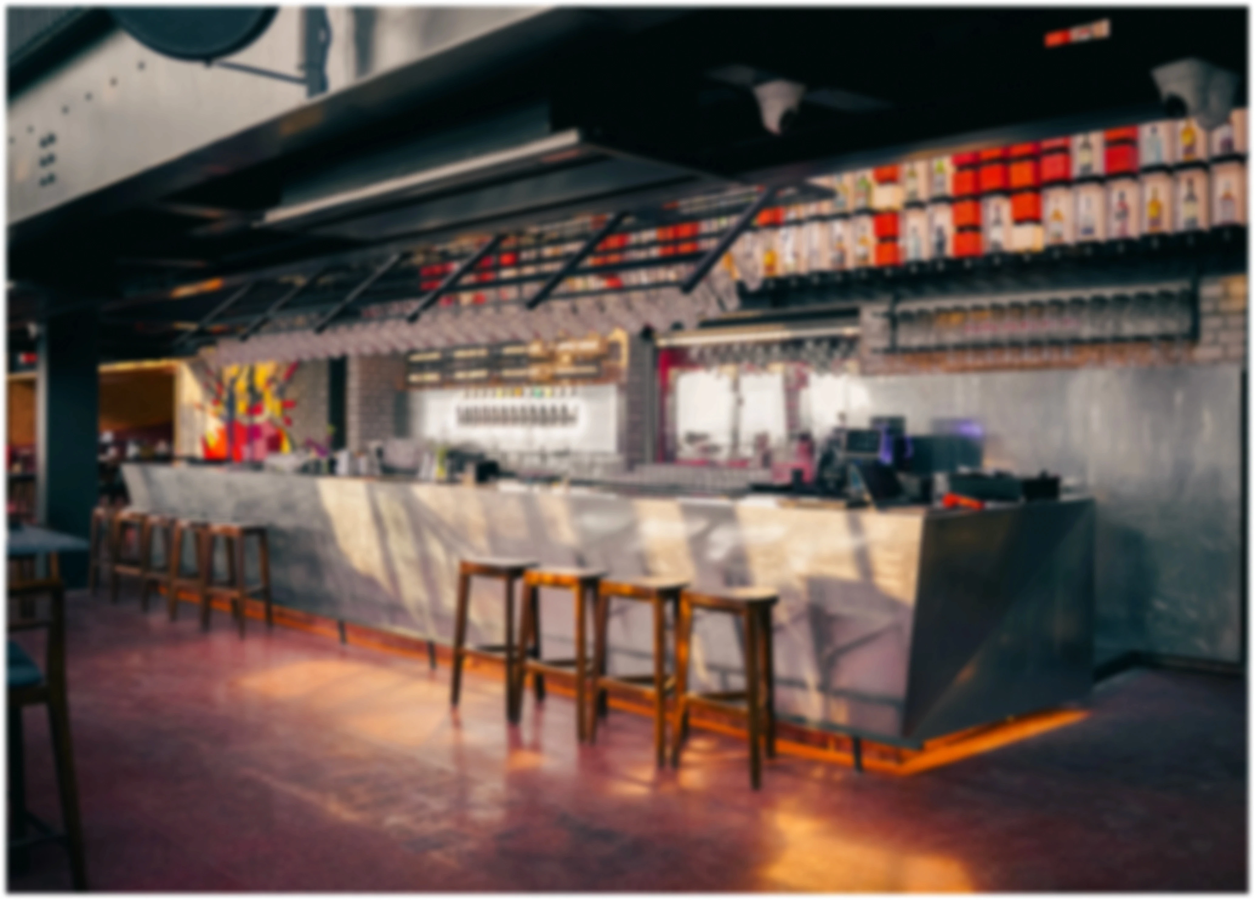 Modern Red Rhino bar interior with marble counter and high stools