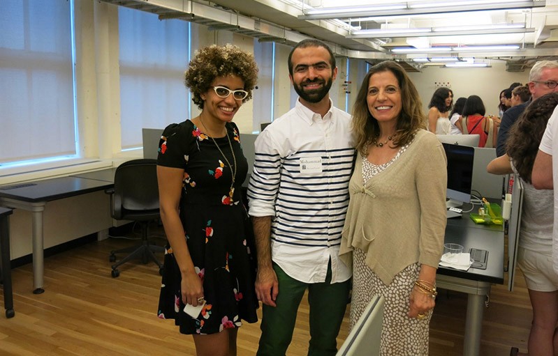 group photo of two women and a man in the middle
