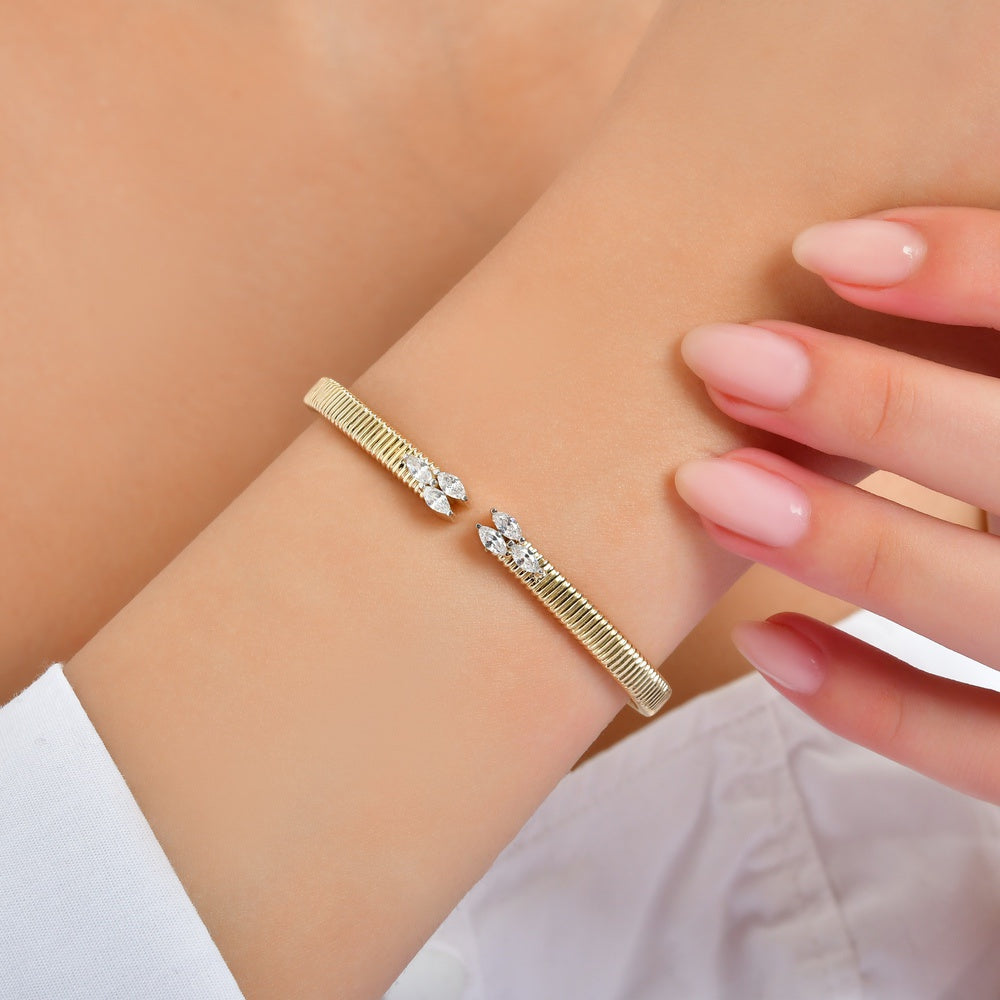 Dazzling 14K Gold Stone-Studded Bangle Bracelet - Elegant Design for Women