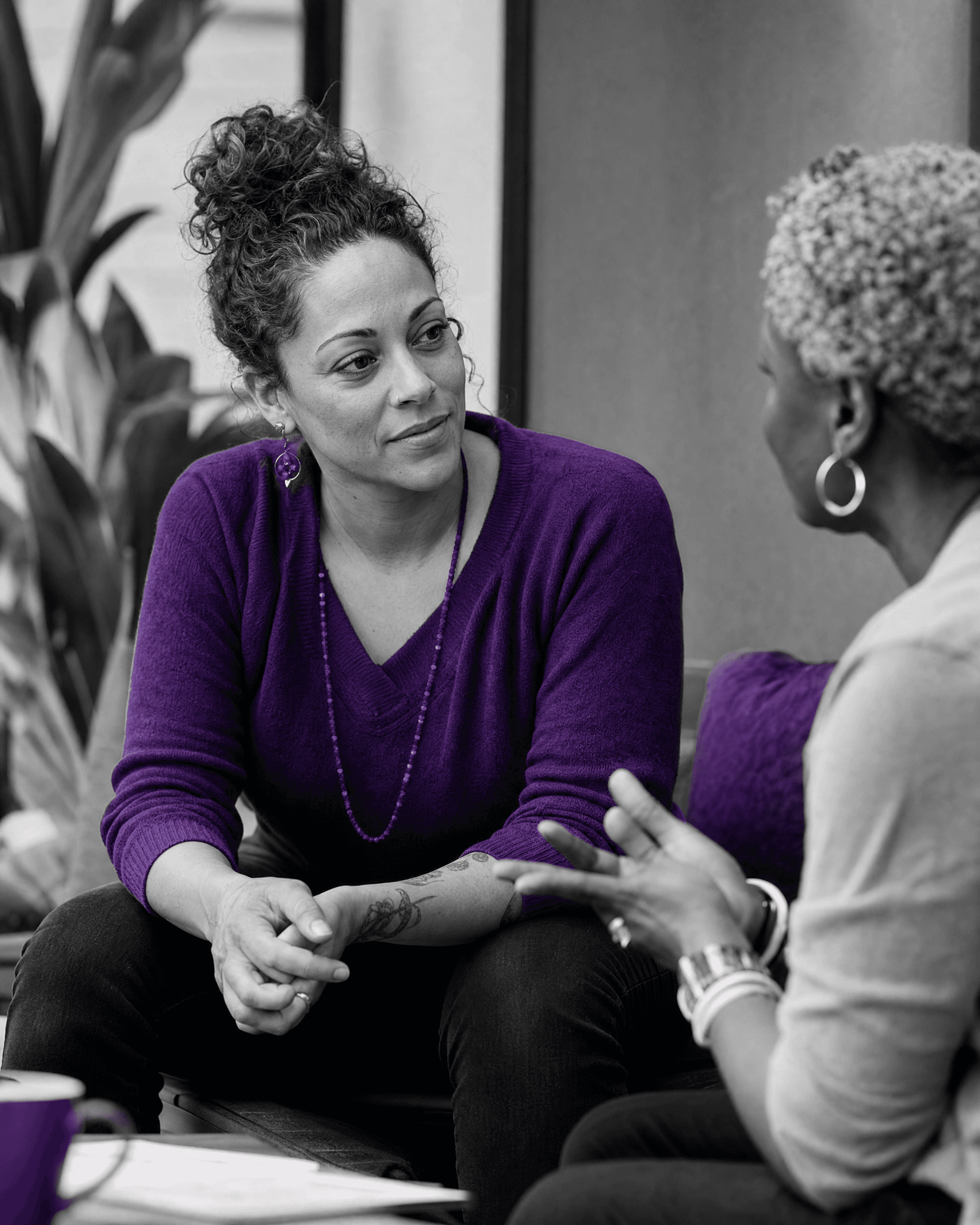 Two adults engaged in lived-experience peer mentorship.