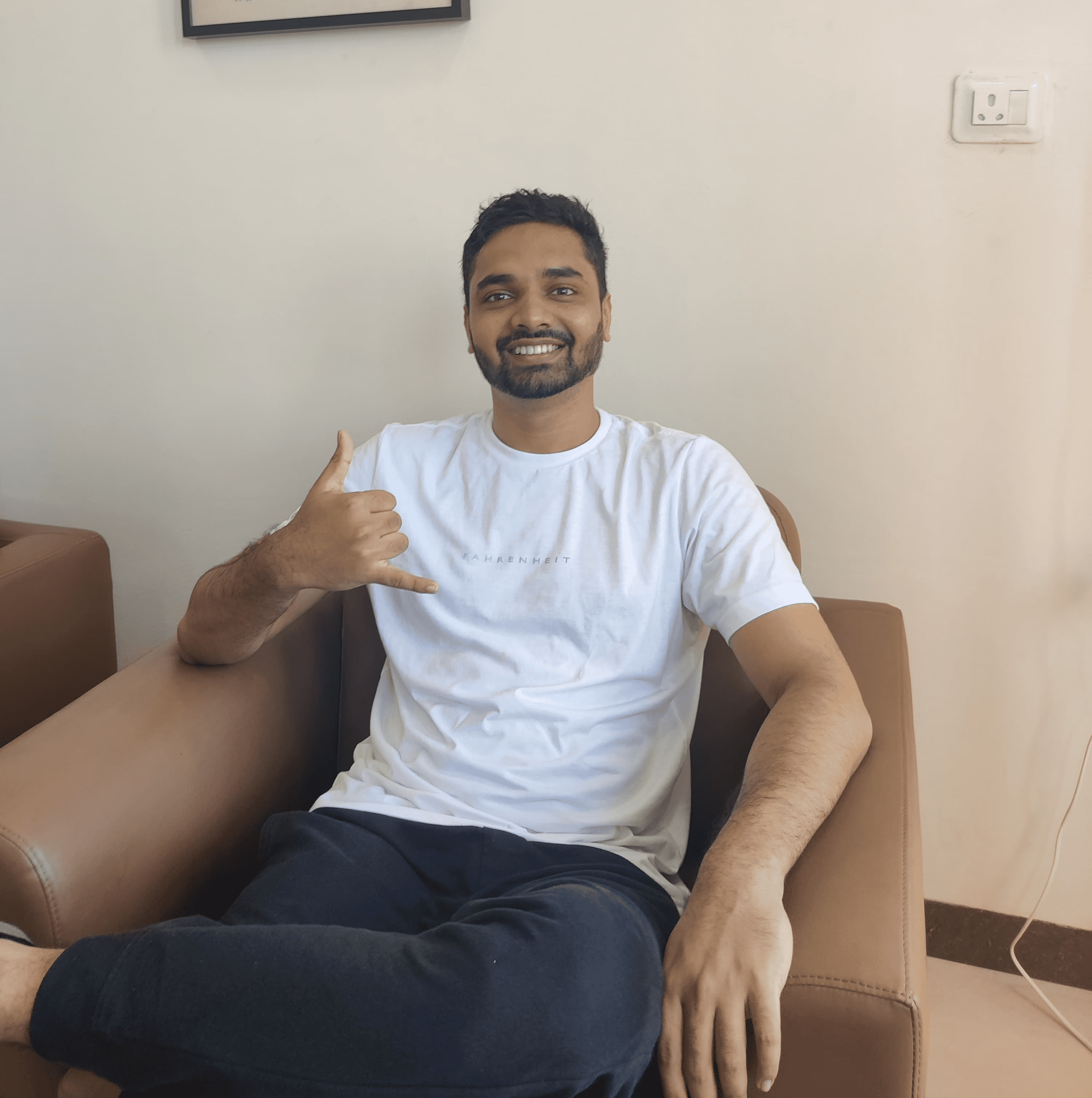 man in gray suit jacket and black pants standing on brown concrete pathway during daytime