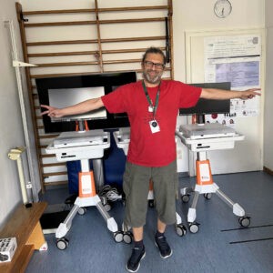 A child life specialist celebrates completing the build of three new GO Karts in Germany.
