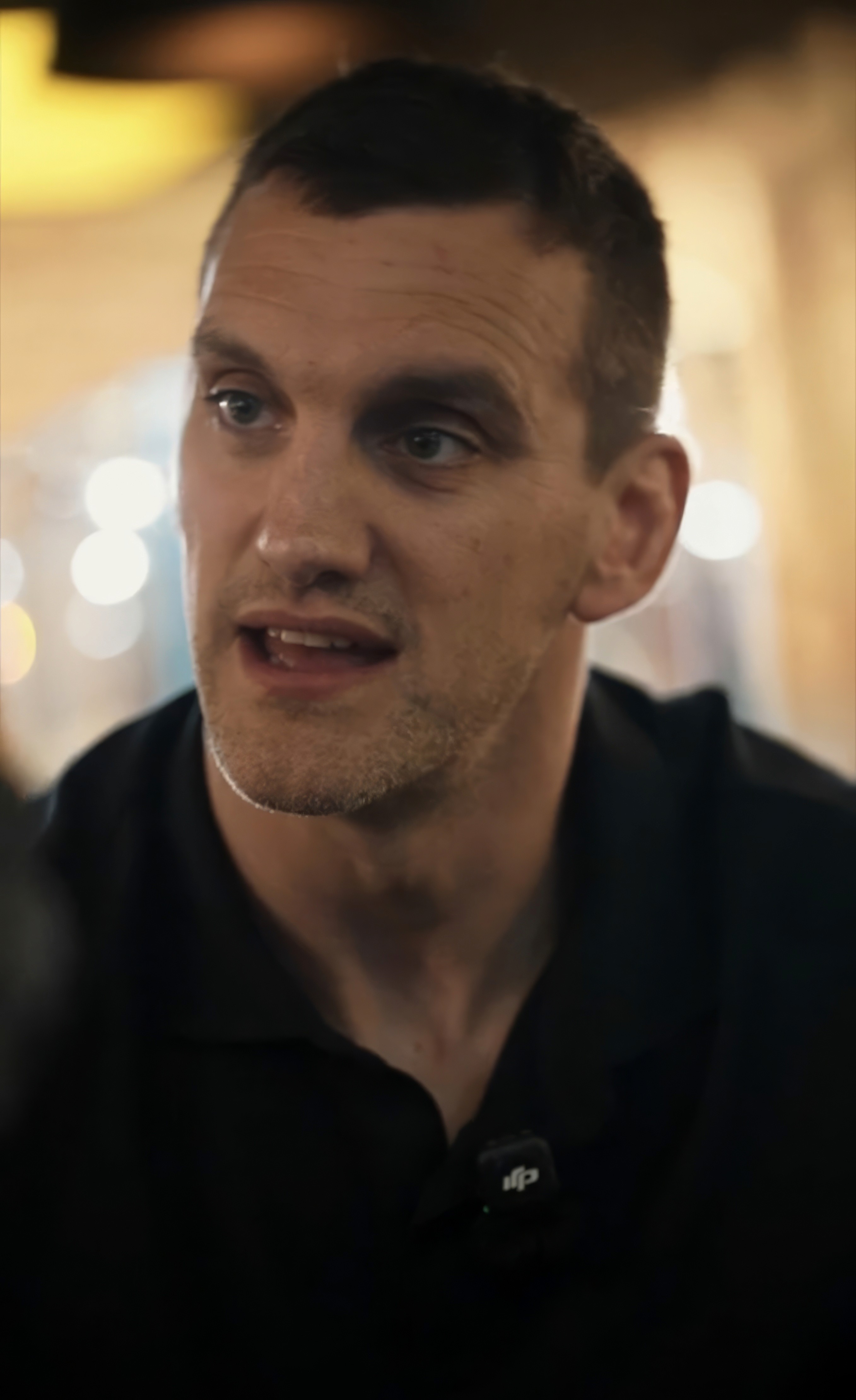 Close-up of bride and groom's torsos, bride in white dress