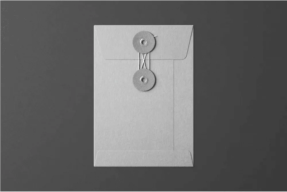 Red string-tie envelope mockup against a black background. The envelope features a minimalist design with two circular black clasps connected by a string for secure closure.