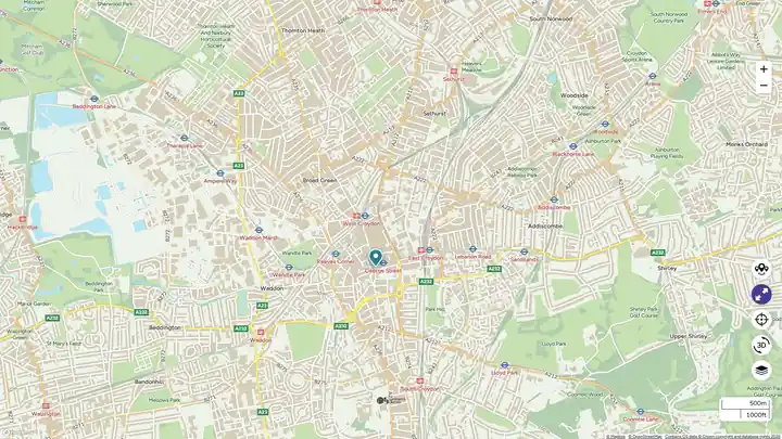 Map of urban area with roads and green spaces.