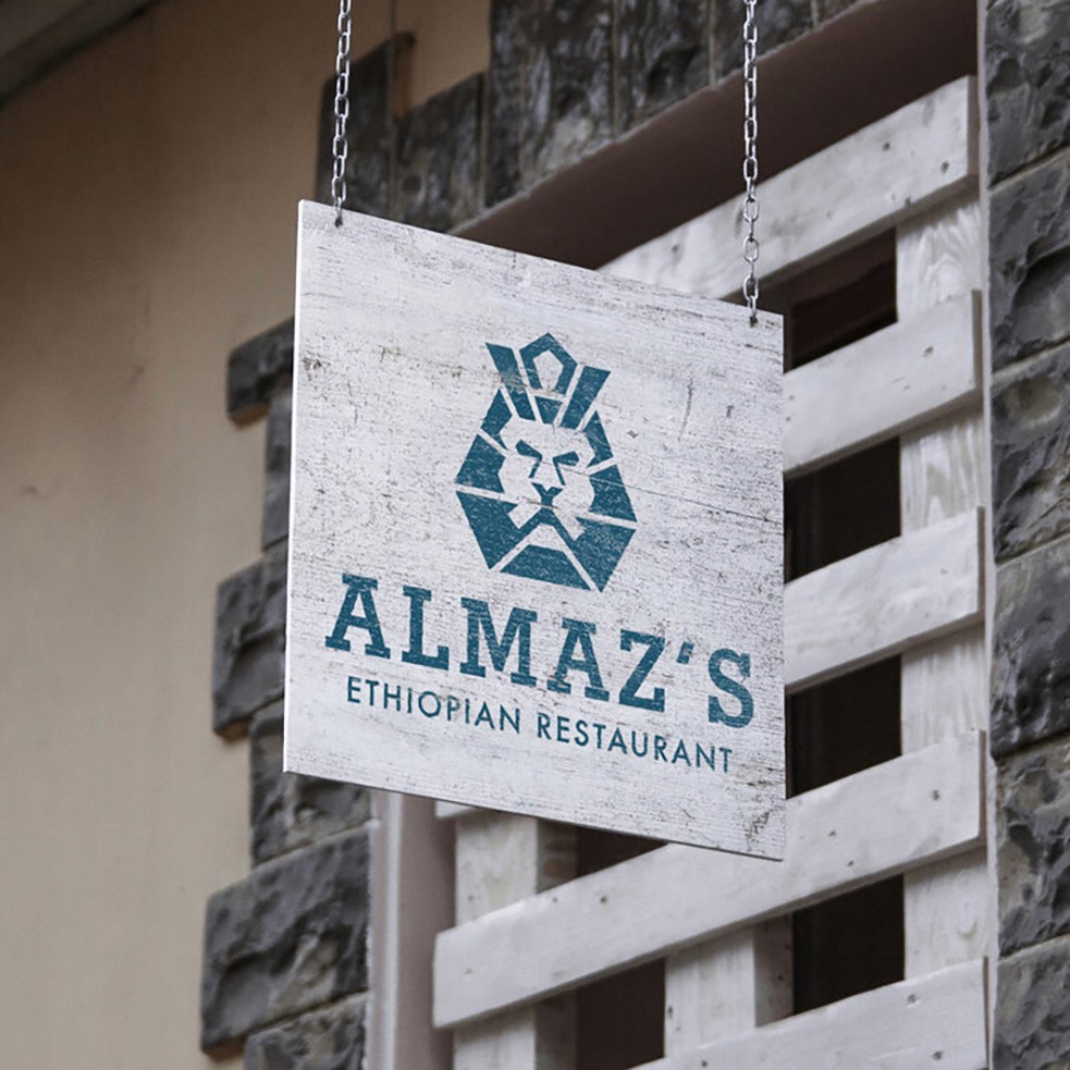 Almaz's Logo Design mocked up on a sign with texture