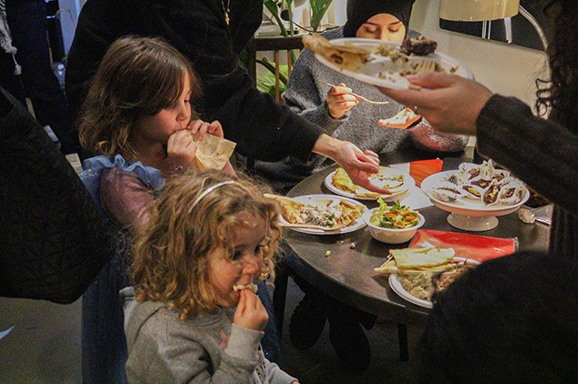 two kids eating in a restaurant