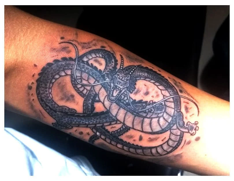 Dragon realism forearm tattoo by best tattoo artists in Bangalore at Fred's tattoo studio, Bangalore, showcasing one of the best tattoo places in Bangalore