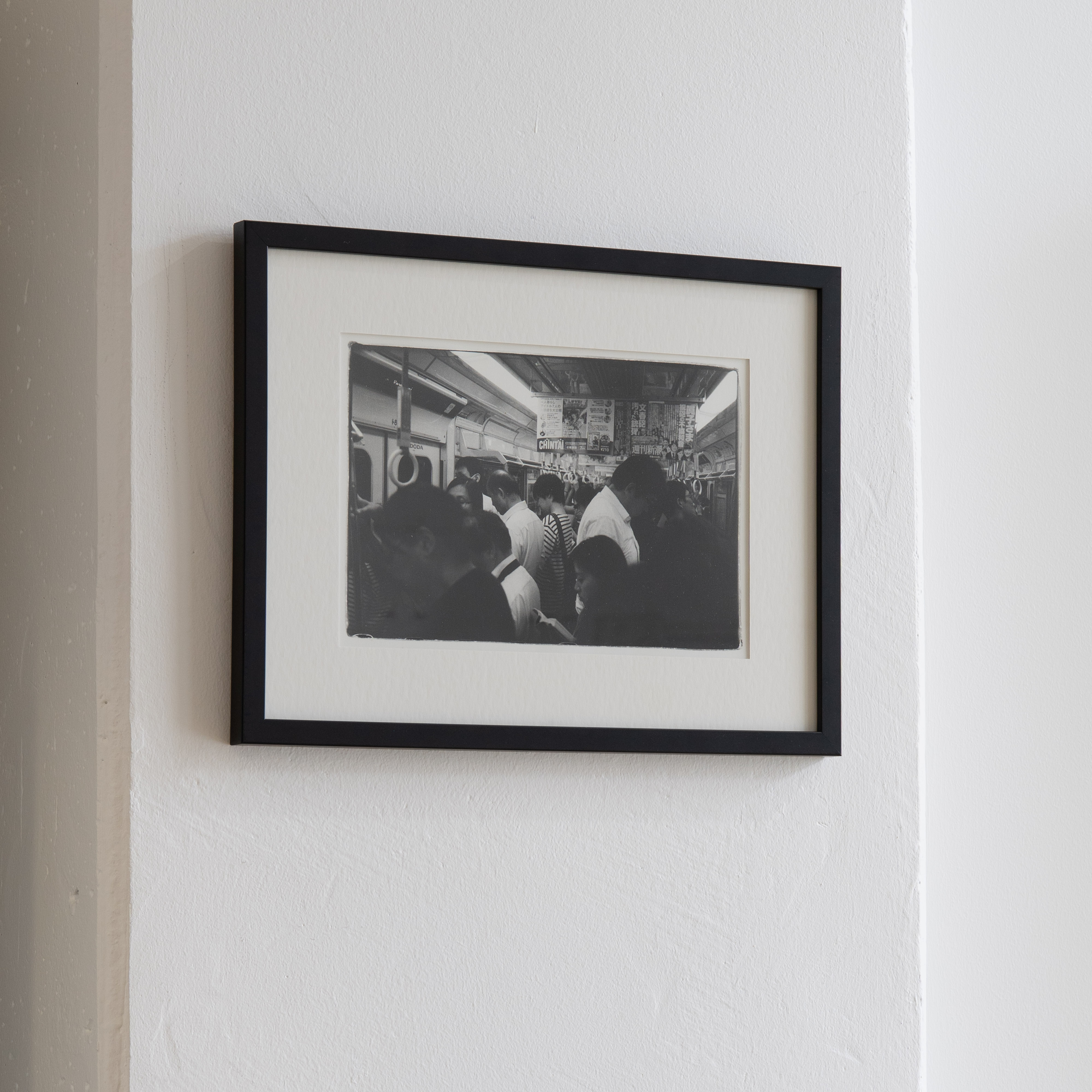 Darkroom prints drying on wire racks