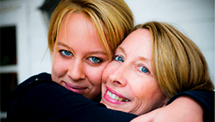 Carolyn and her daughter Laura hugging