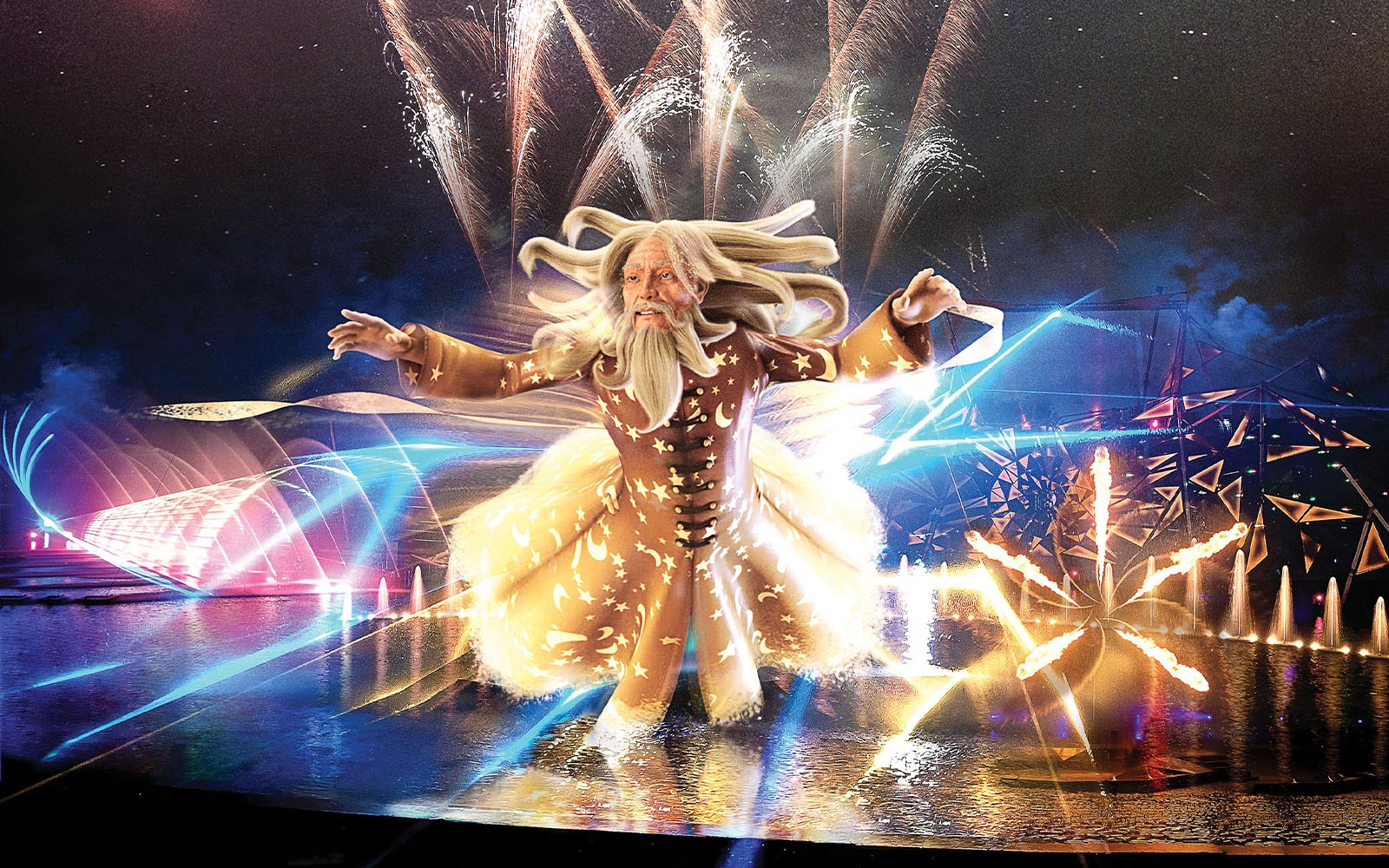 Futuroscope night show with illuminated wizard figure and fireworks display.