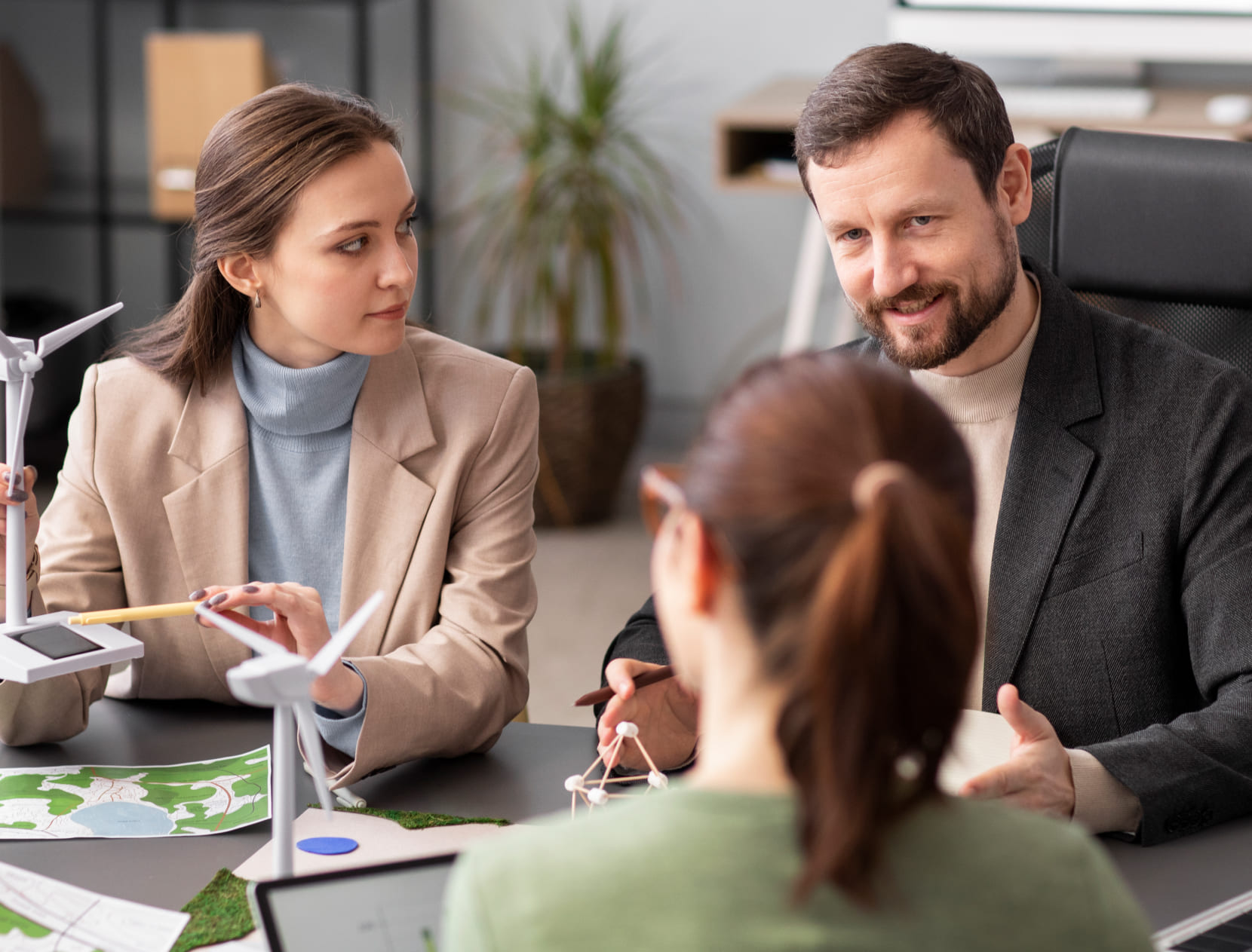 Two professionals reviewing documents in a meeting