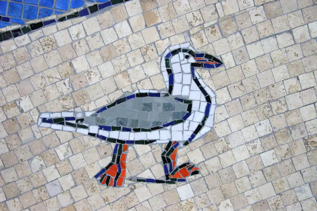 Mosaic mural of a seagull at San Diego Airport, created by Mosaic Legs Art Studio.