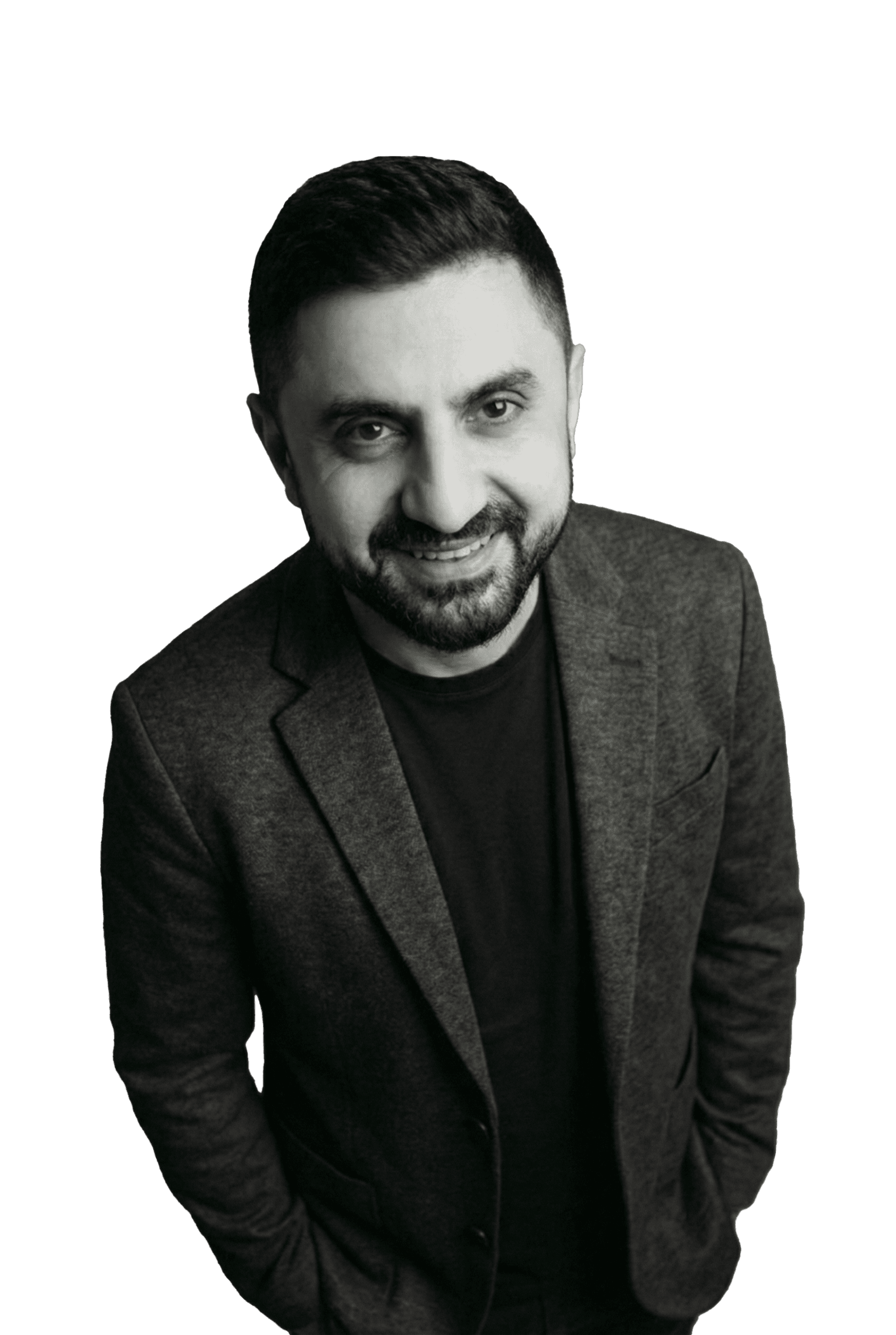 Professional woman in a suit standing in an office setting.
