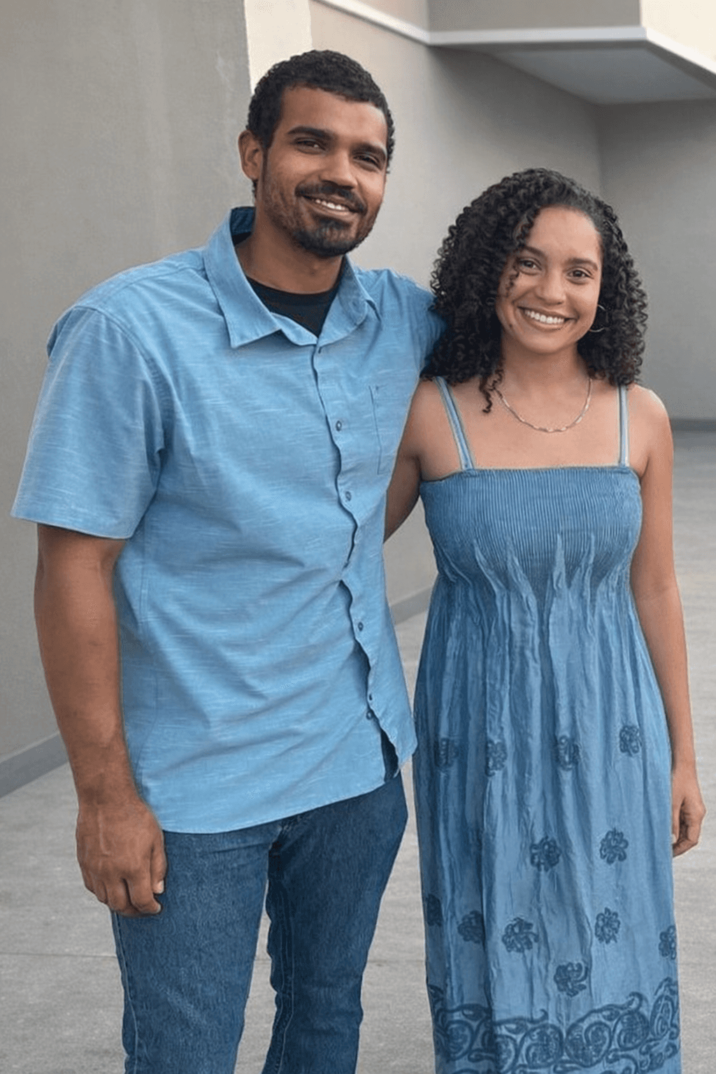 A brother and sister smiling