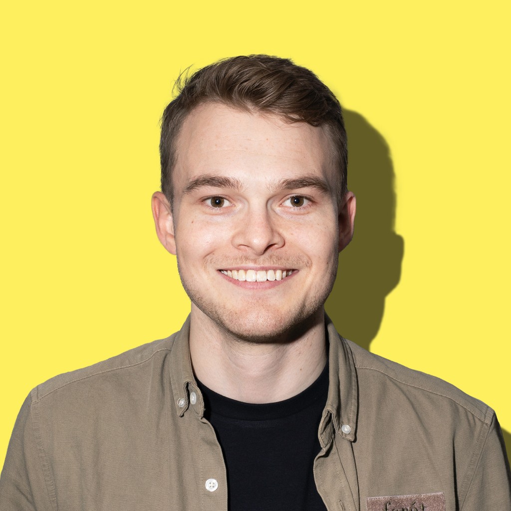 A portrait of a Vibrant employee with colorful background