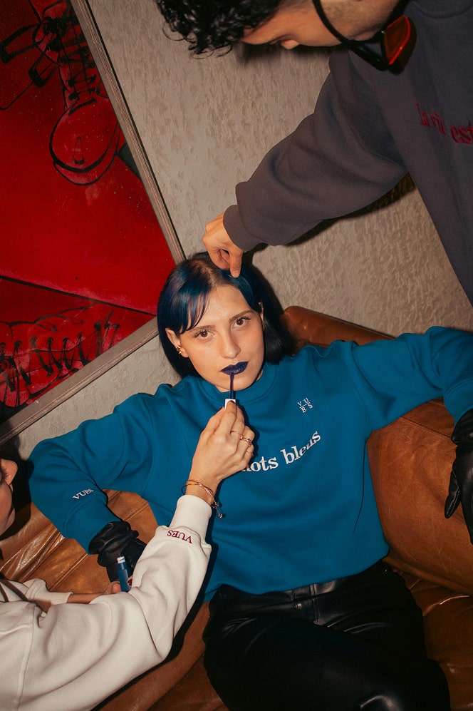 a person sitting on a couch with a laptop