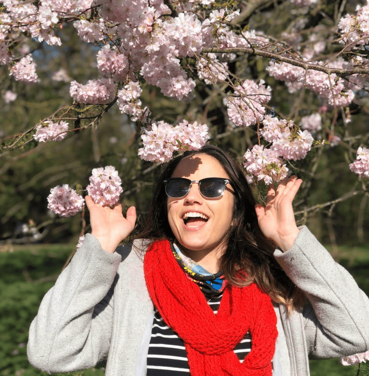Creative portrait with geometric pink eyewear and bold fashion styling in urban setting