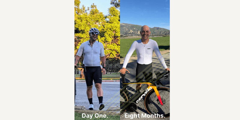 a couple of people riding bikes down a road