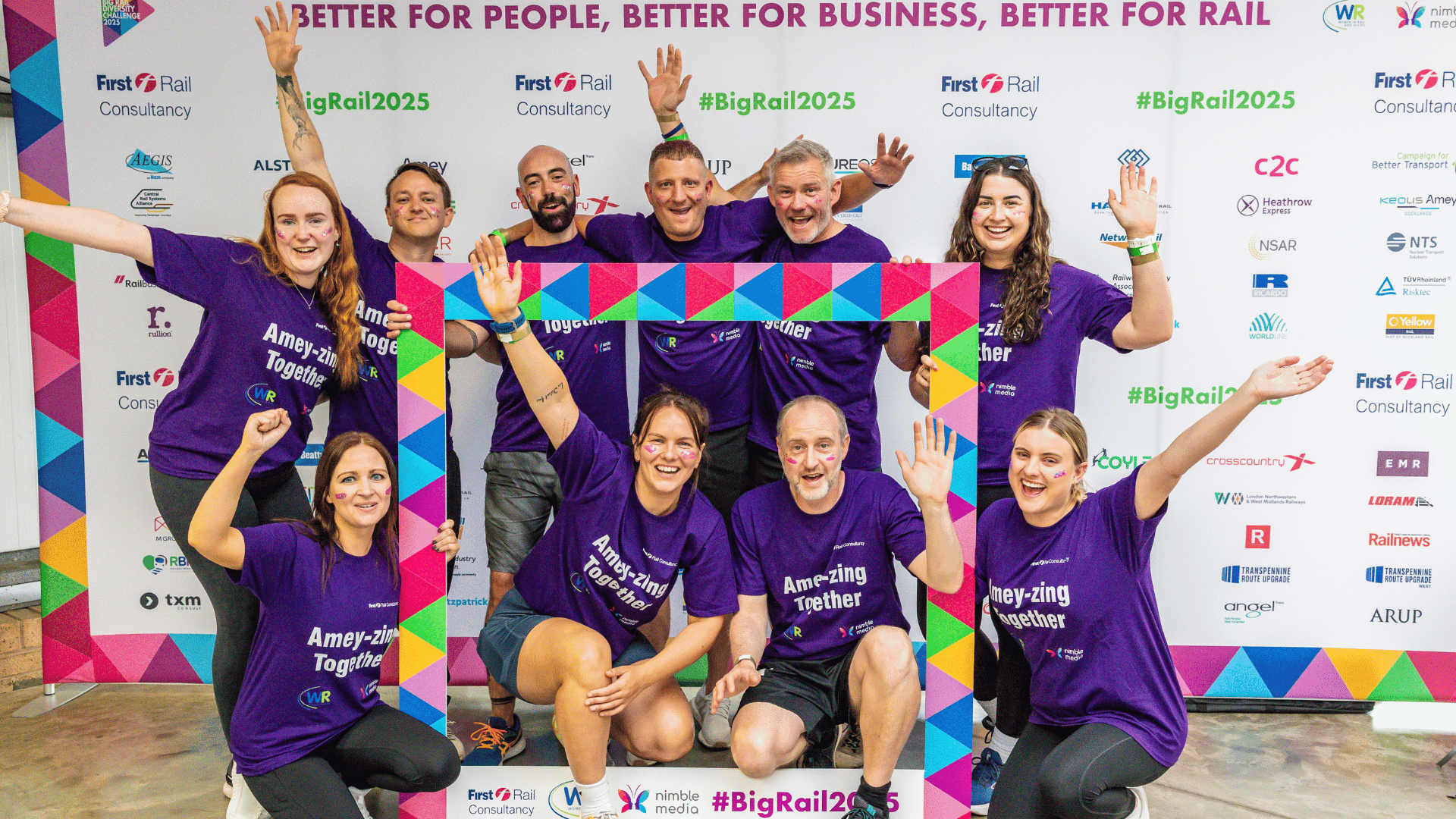 Outdoor team-building event with participants wearing matching blue shirts, taking part in inflatable obstacle courses and games, smiling and cheering, with the words 'ENTER A TEAM' in large bold white and green text across the image.