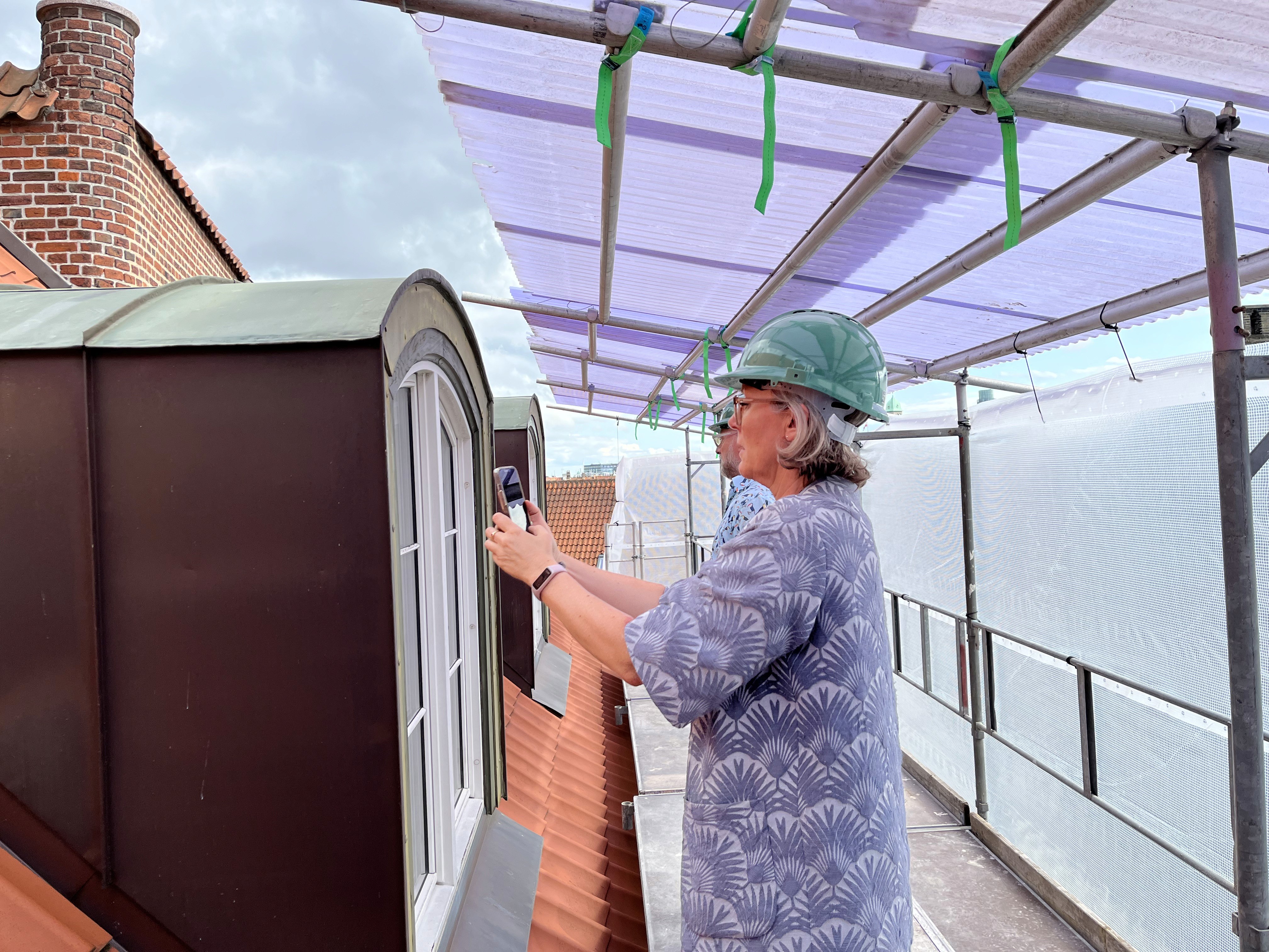 cars on road near buildings during daytime
