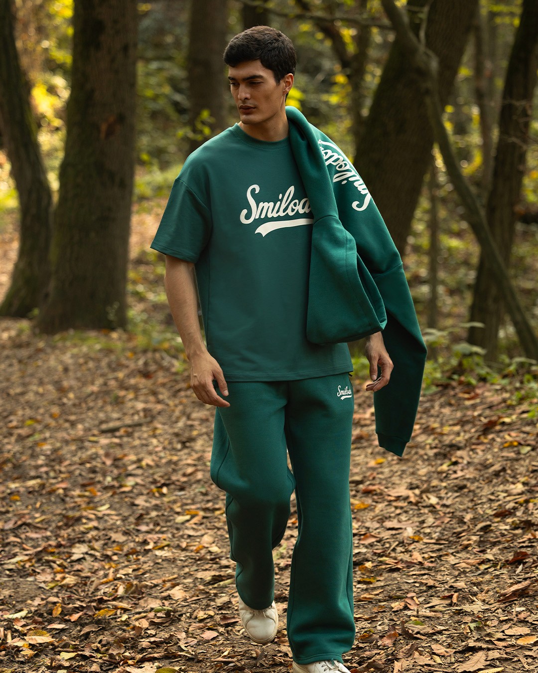 Woman in white breezy shirt.