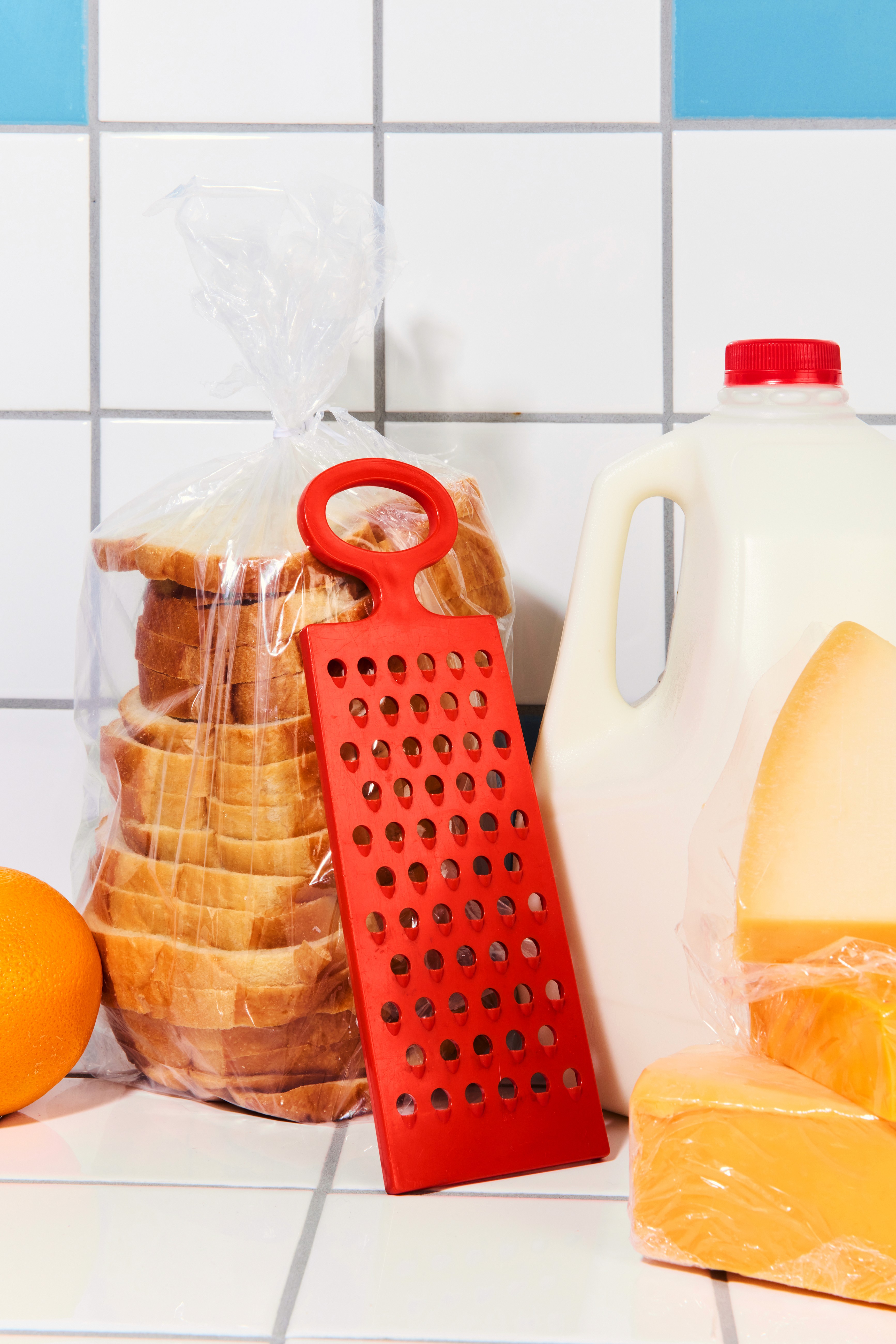 Athletes resting on a blue running track.