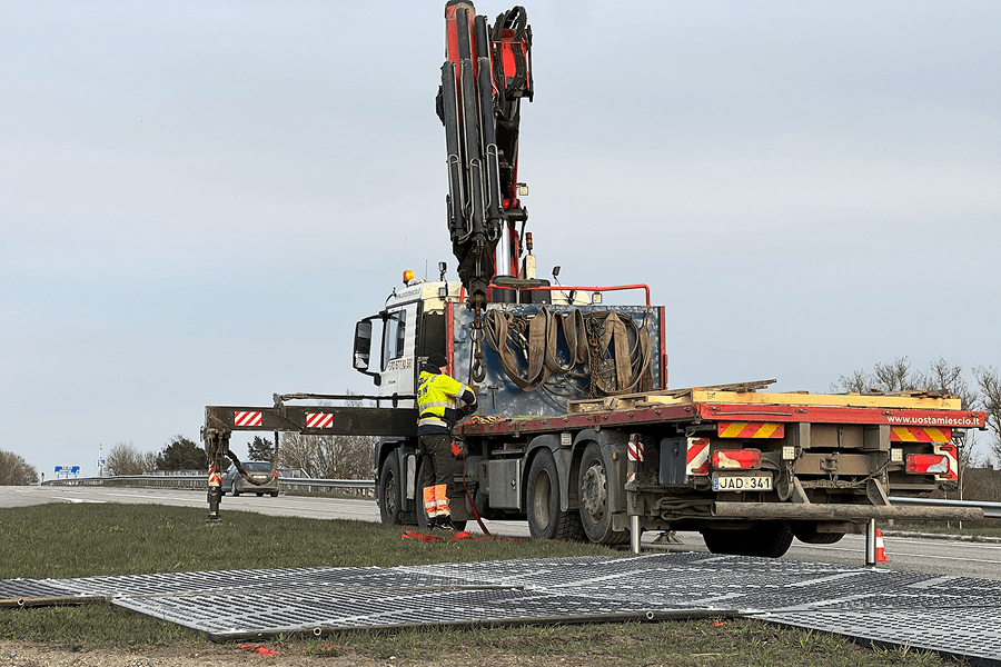 Protection and reinforcement of road and surrounding surfaces laying plastic