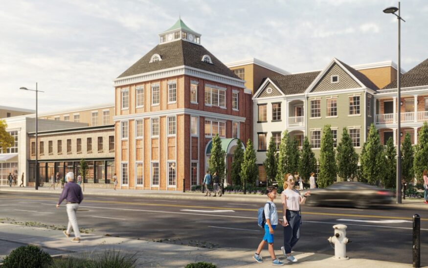 A large brick institutional or residential building featuring a distinctive green cupola, highlighting an active community project safeguarded by M-Fire suppression technology.