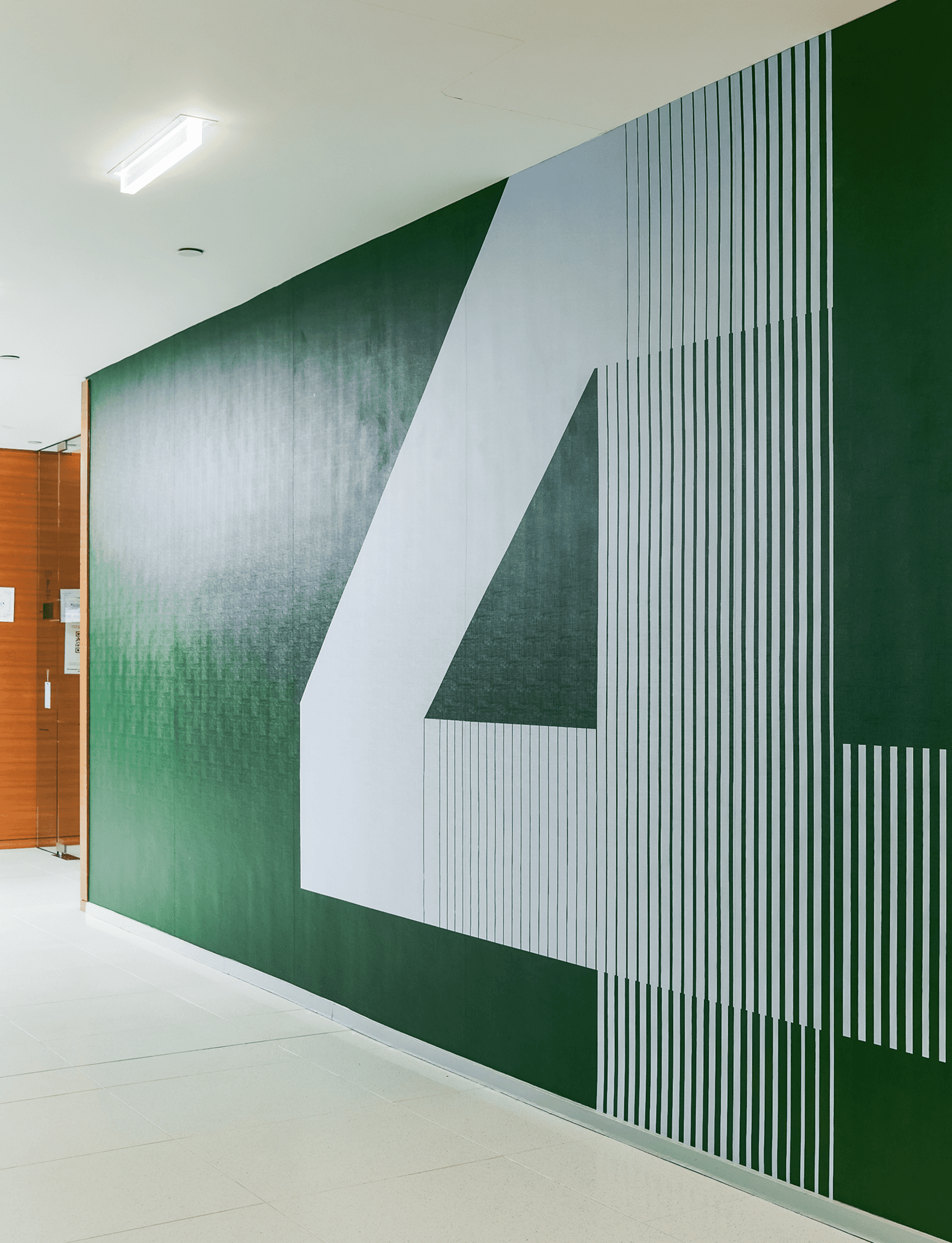 Streetside billboard with flyposters of the Batch.Works brand and illustrations