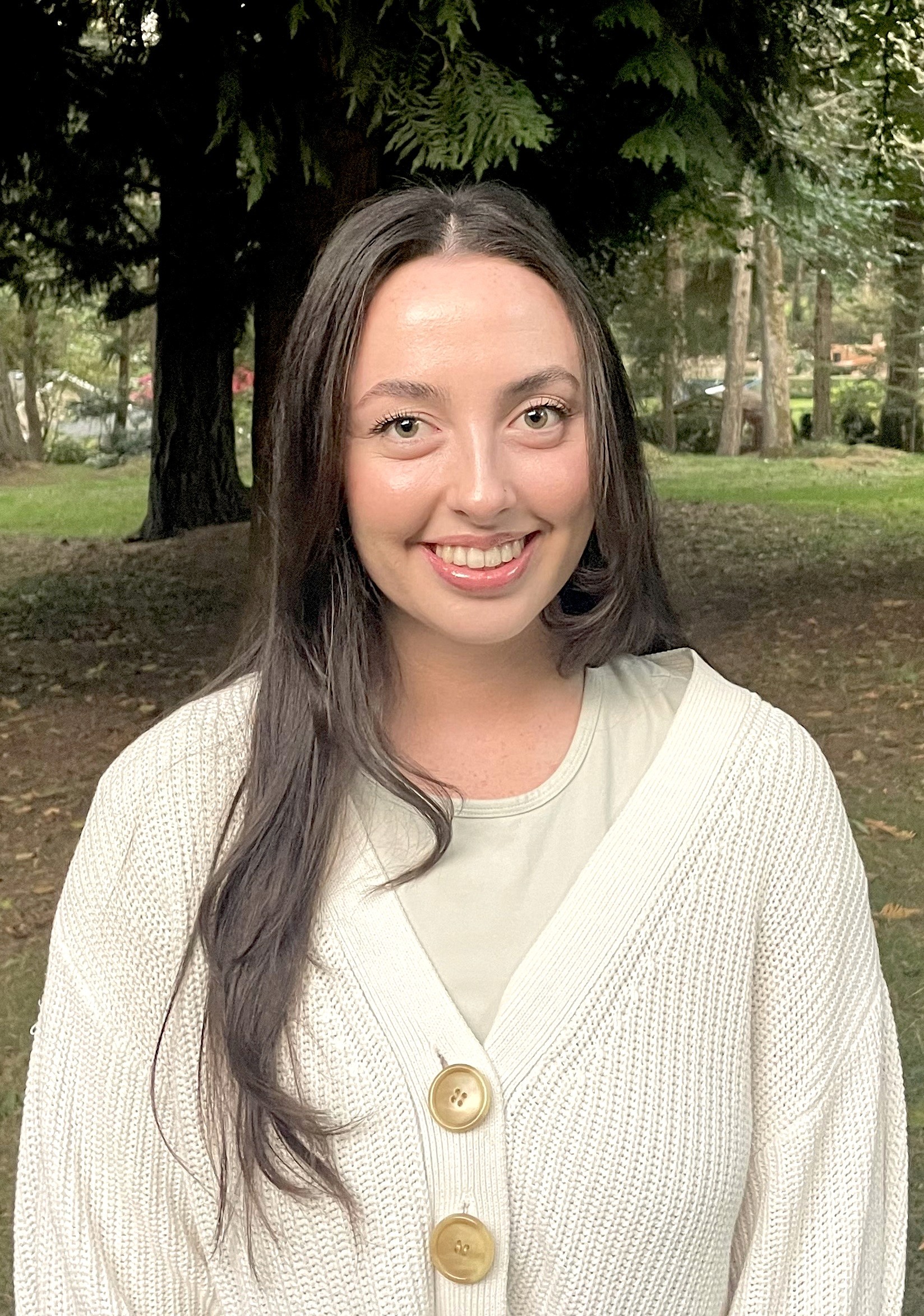 Close-up of a tree stump showing growth rings and a textured brown wood surface.