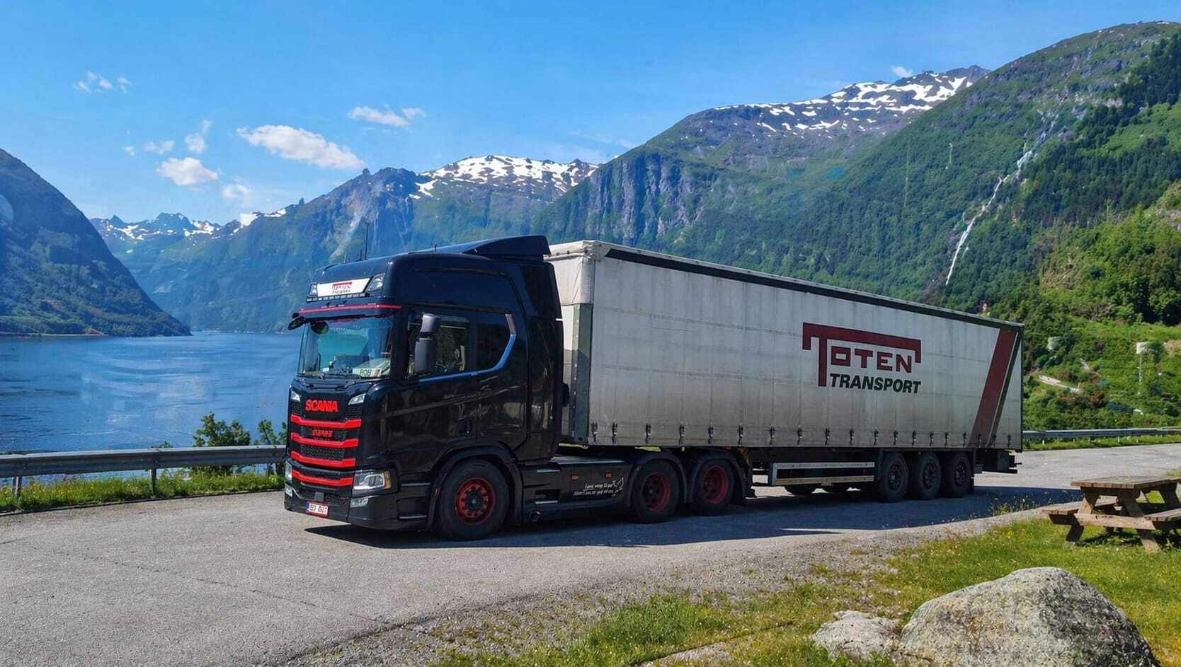 Toten Transport truck and trailer parked by a Norwegian fjord