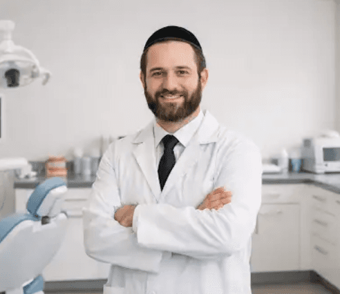 smiling woman wearing academic dress and black academic hat