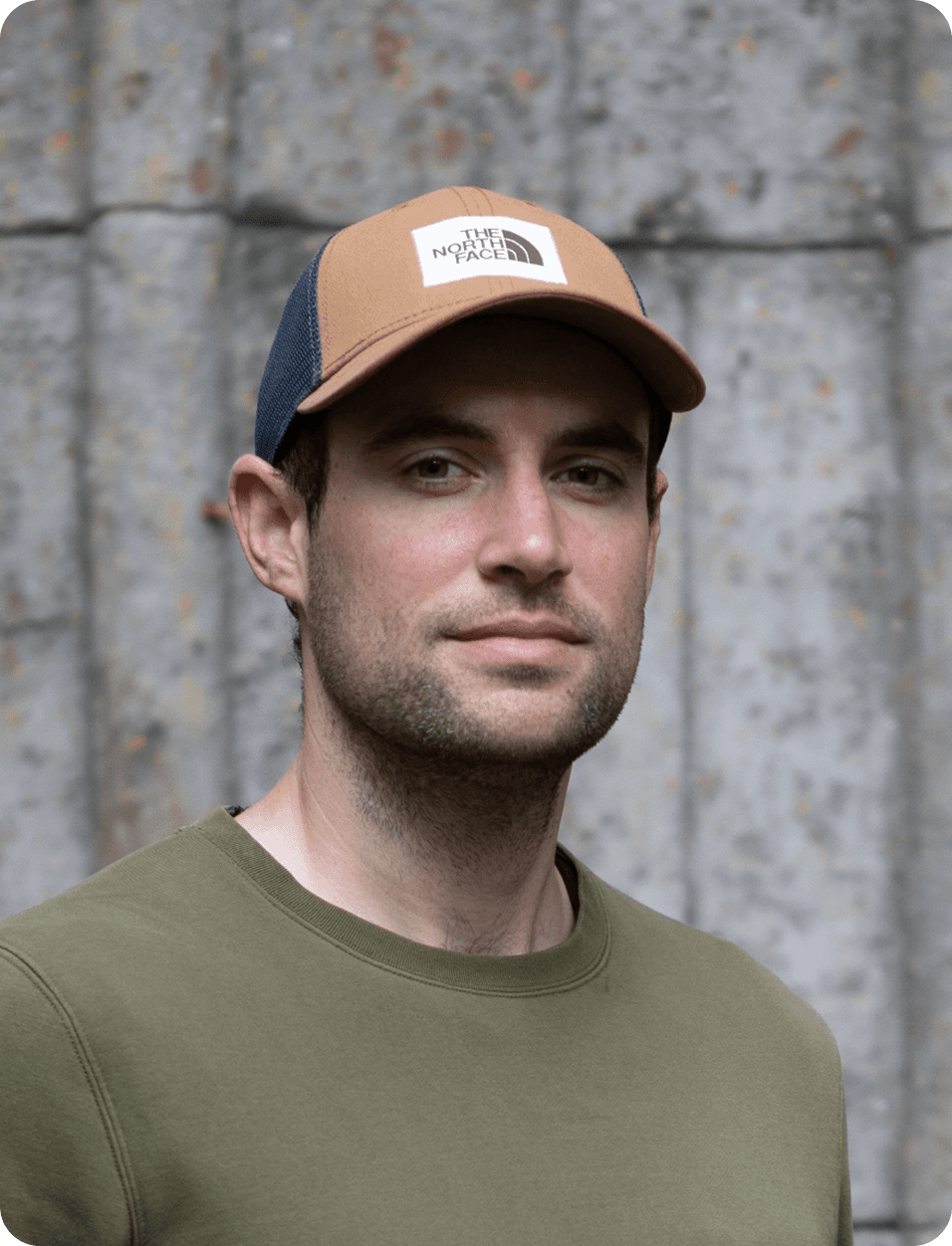 Person holding a smartphone with a camera lens