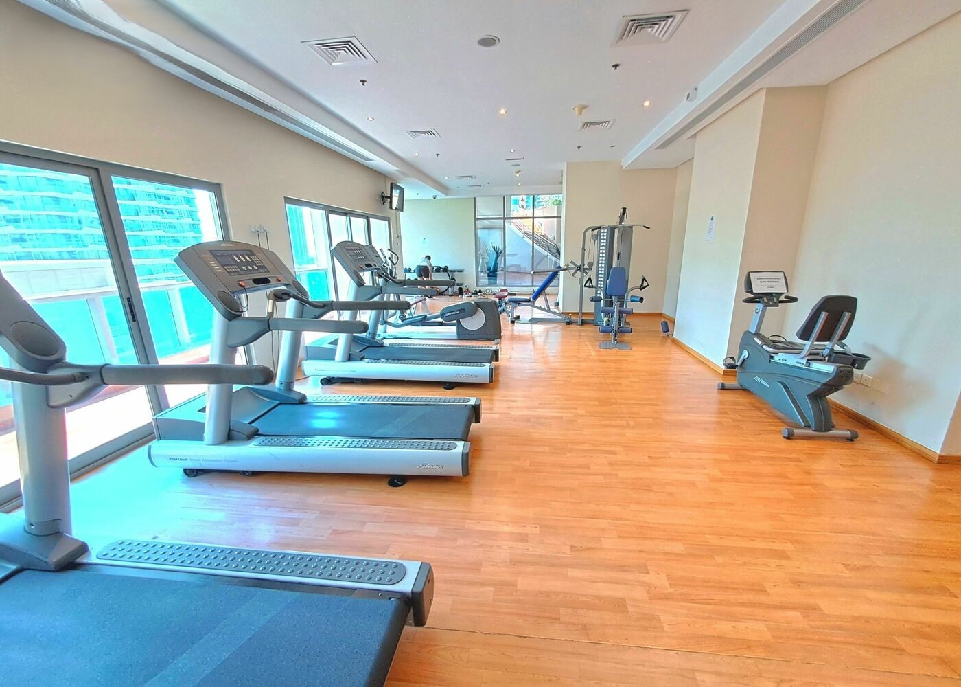 Fully equipped fitness center and gym amenities for residents at Zumurud Tower Dubai Marina.