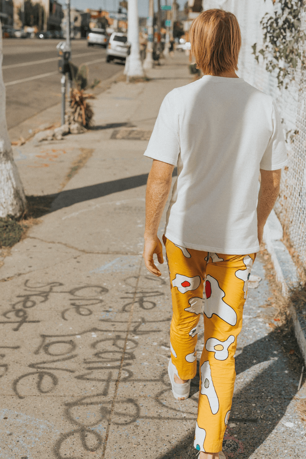 Person wearing yellow pants