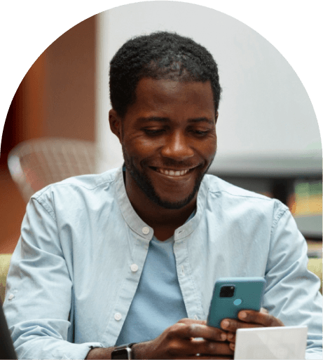 African man smiling on phone