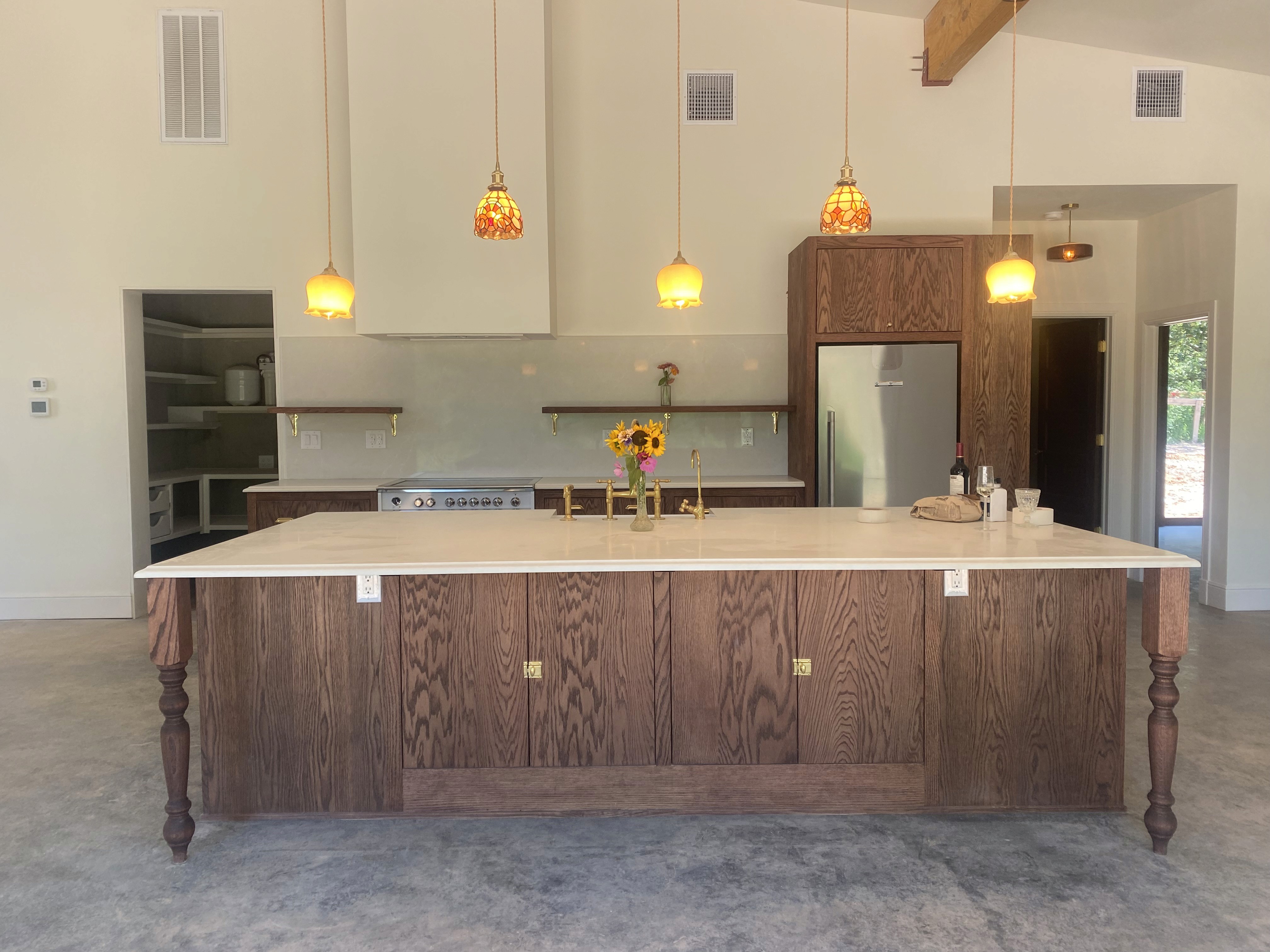 red oak kitchen cabinets and vintage pendance lights
