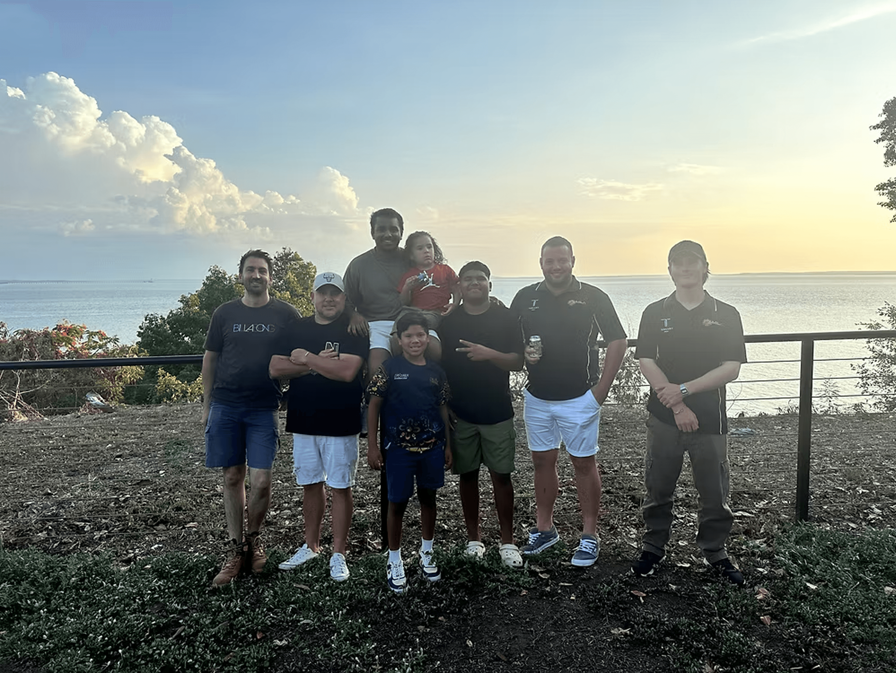 a large rock with a tree on top of it