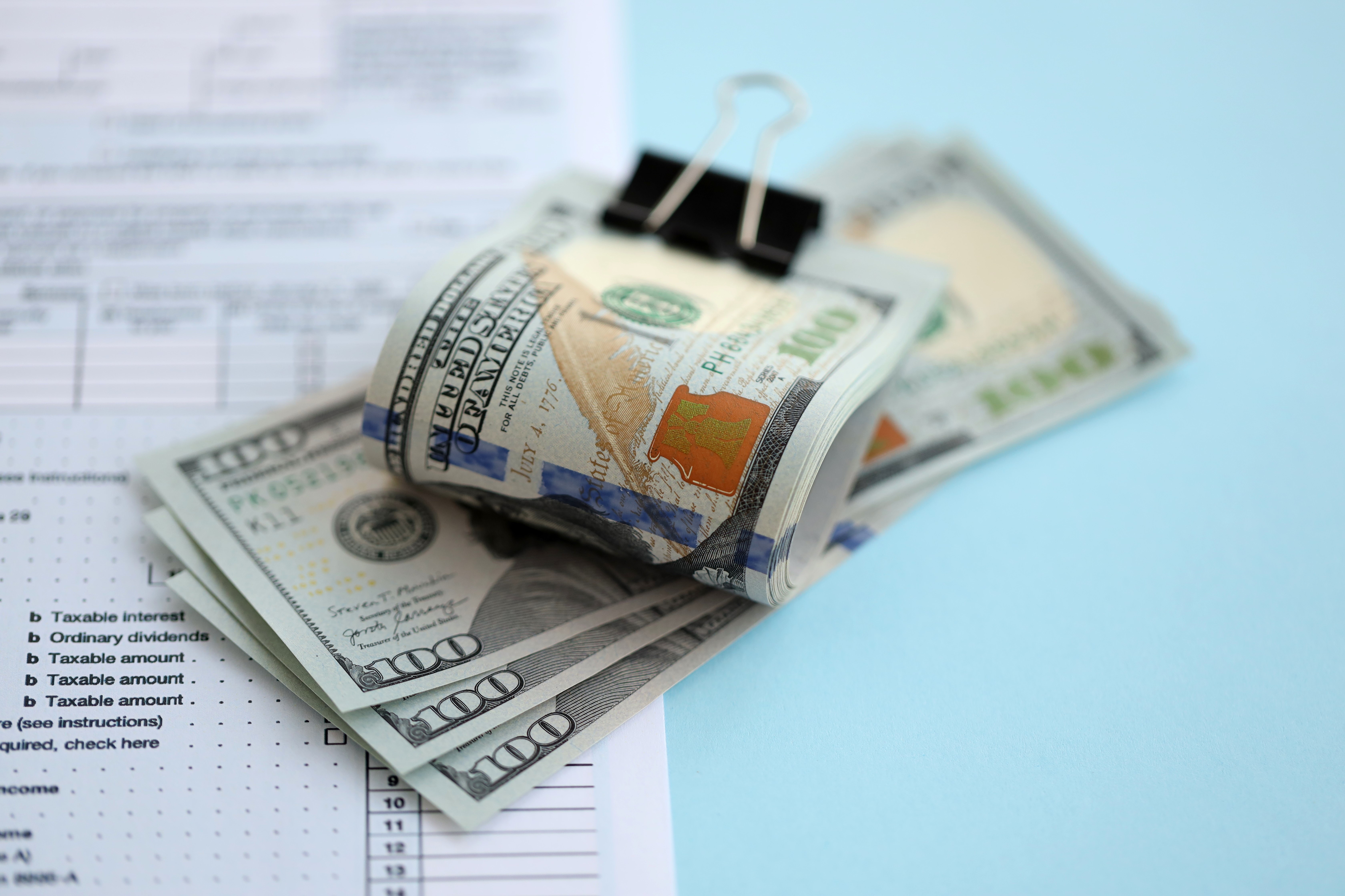 Money and financial paperwork symbolizing cash flow and accounts receivable management.