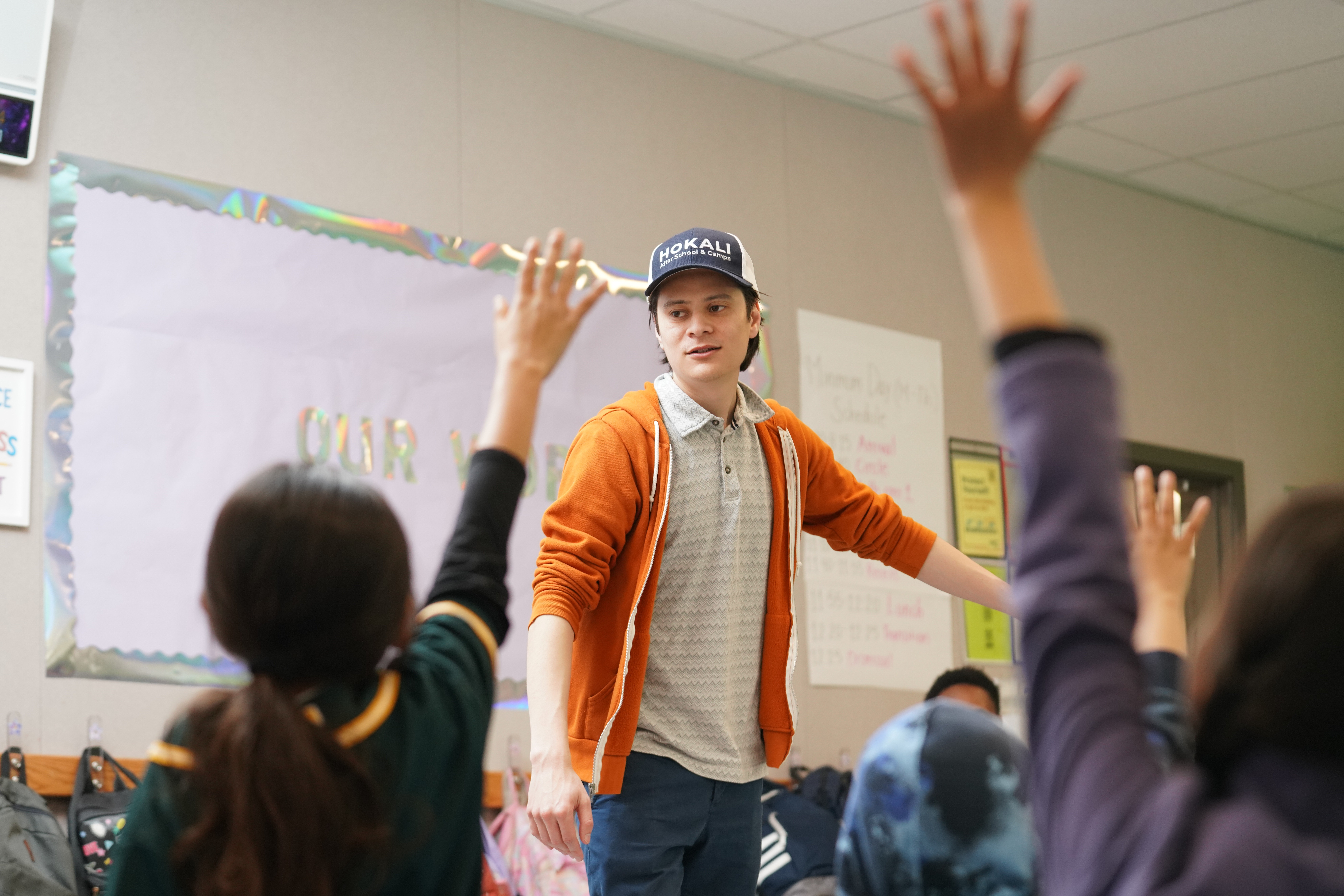 HOKALI educator leading an engaging after-school class, guiding students through interactive learning activities.