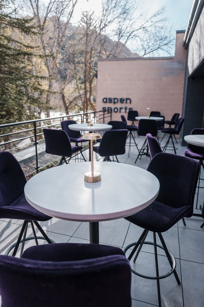 Guests gathered on the terrace during an evening event in Aspen