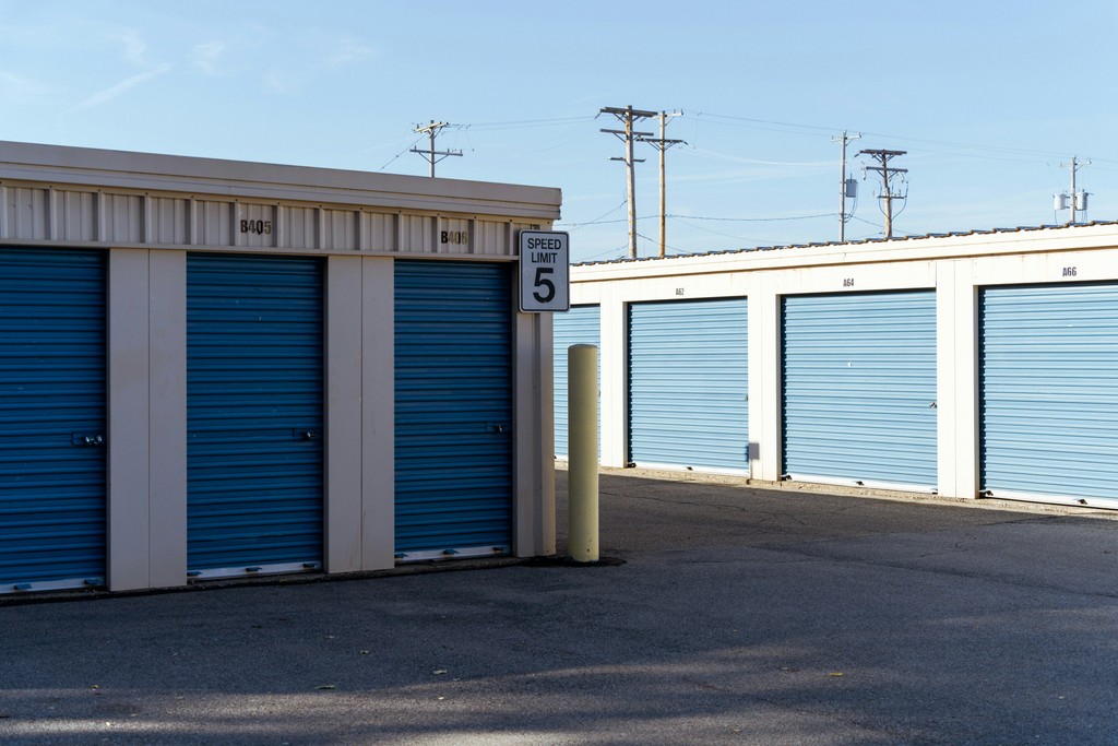 A row of storage units in a parking lot