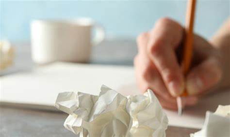 High school students engaged in research and writing, symbolizing perseverance and revision in STEM or law projects for RISE Research summer programs and Ivy League mentorship.