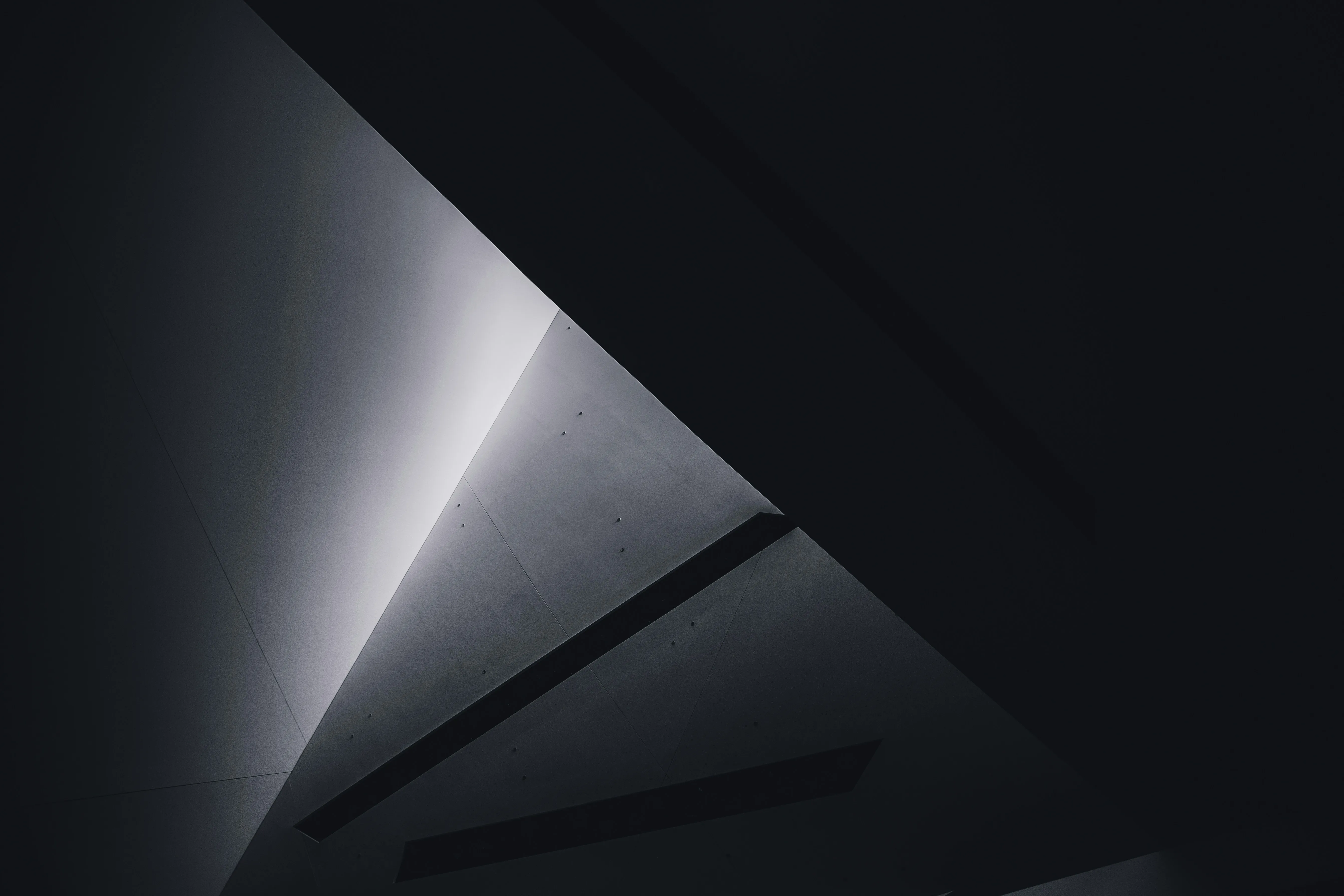 grayscale photo of a tunnel