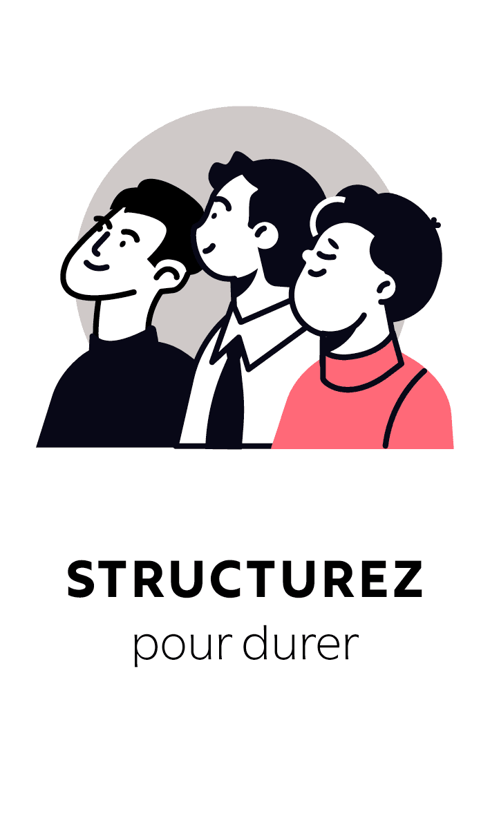 A smiling young man with crossed arms, wearing a plaid shirt and white t-shirt, poses against a dark background.