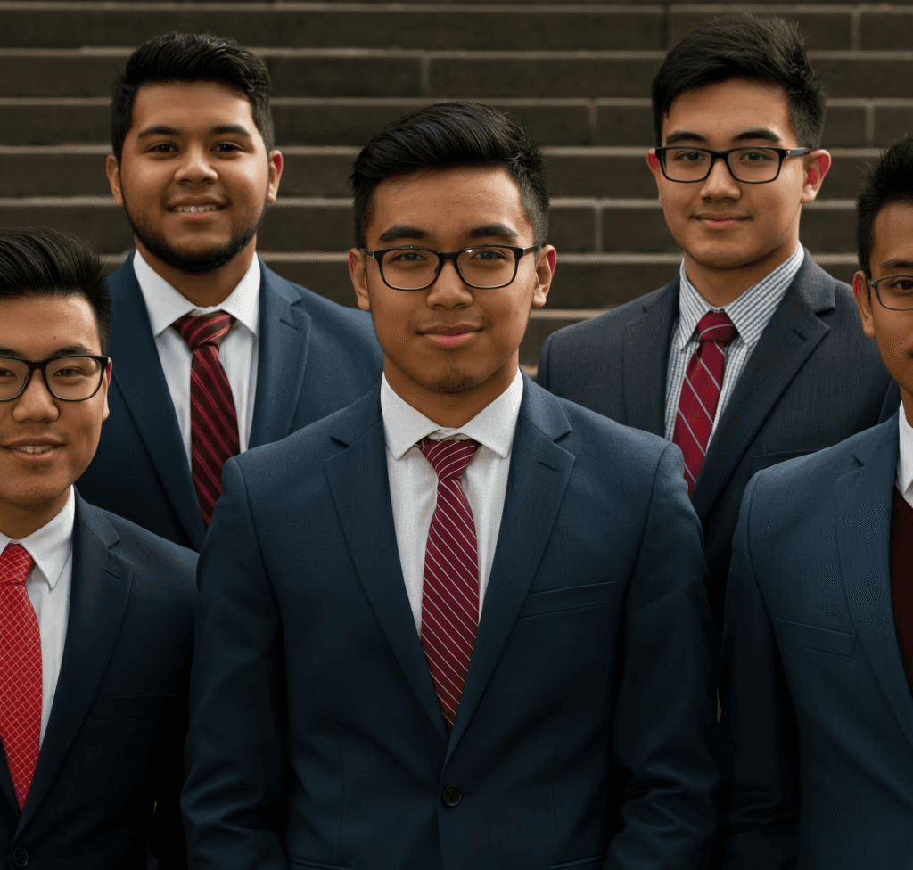 Group of college consulting students in suits that are mostly hispanic 20% white and 10% asian