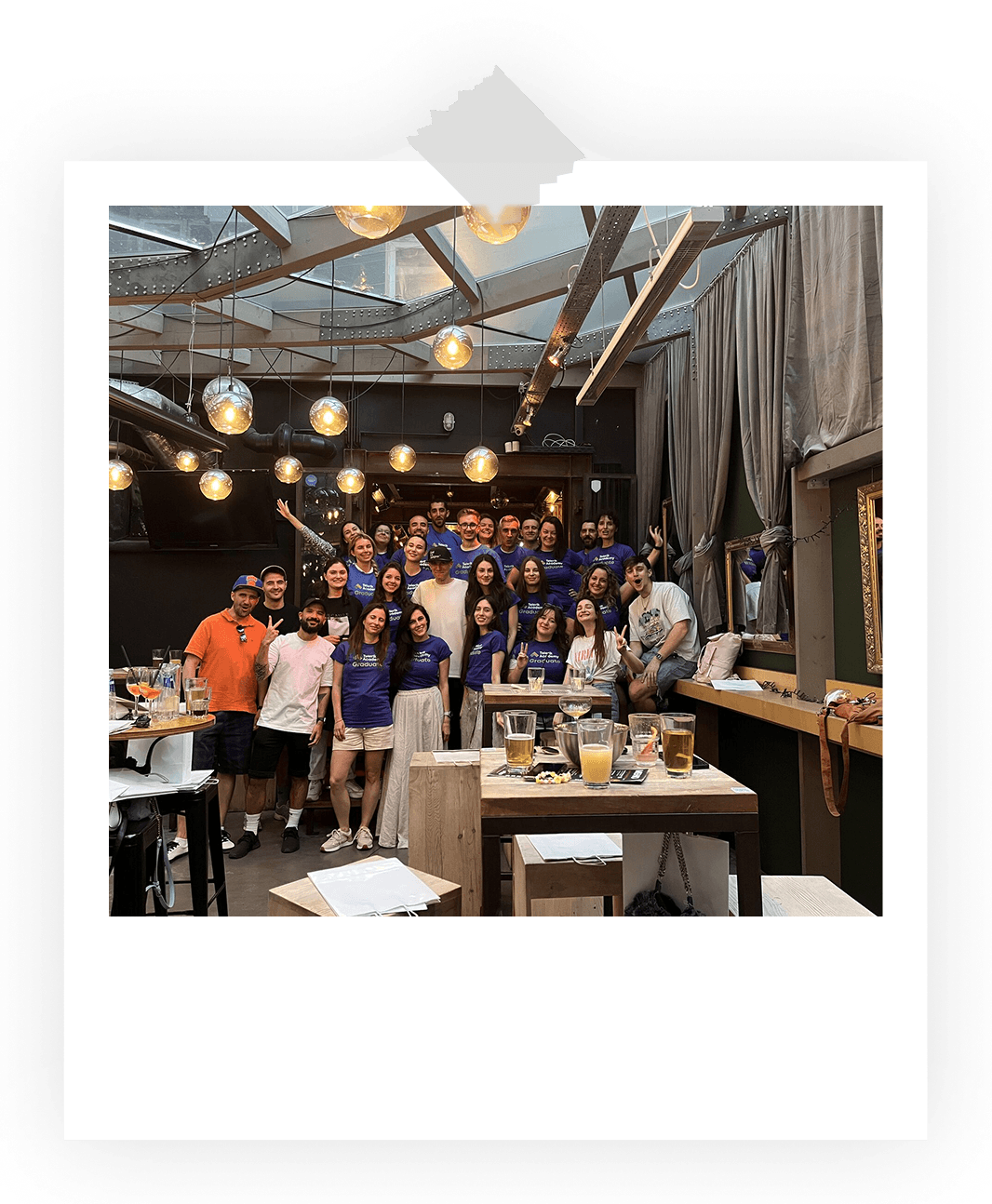 A group photo of Phil and design student part of the Yotpo design program