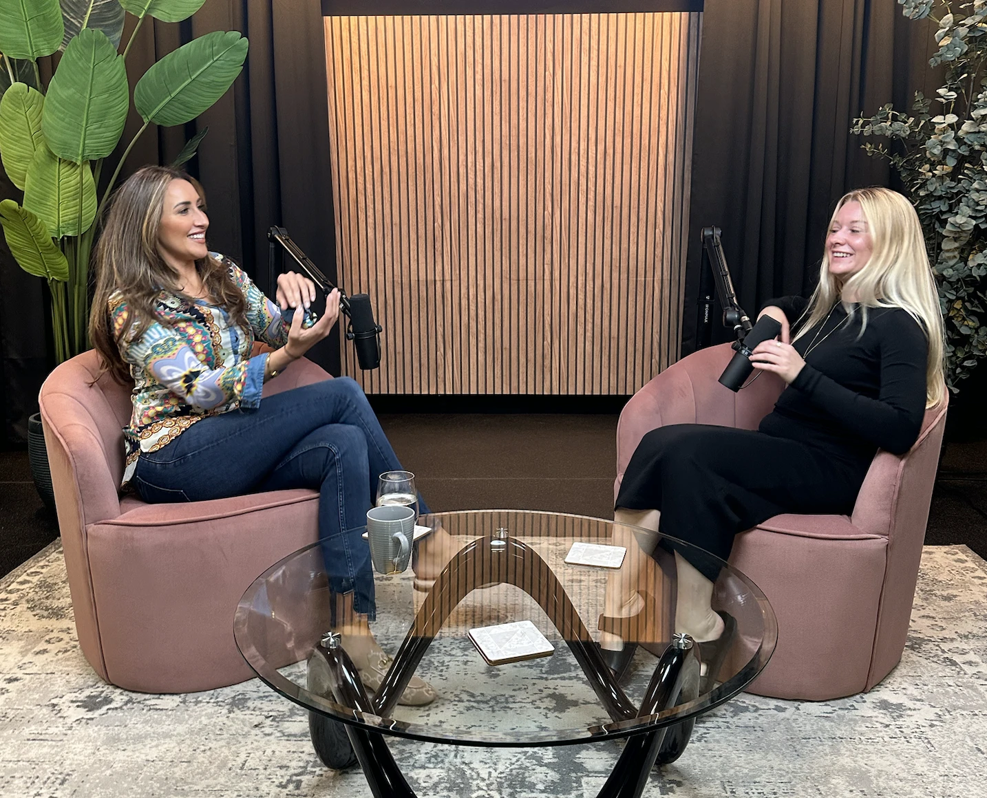 April Maria in a podcast conversation with another speaker in a studio