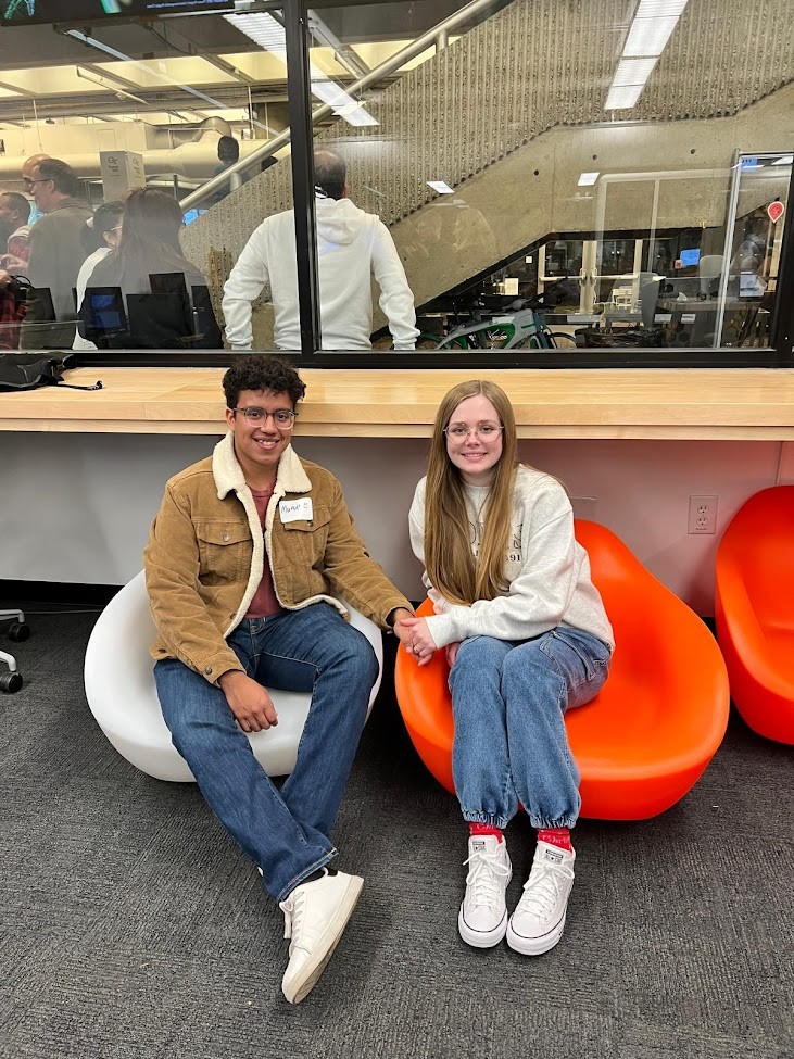 Pen, papers, and color palette swatches on a sunlit desk.